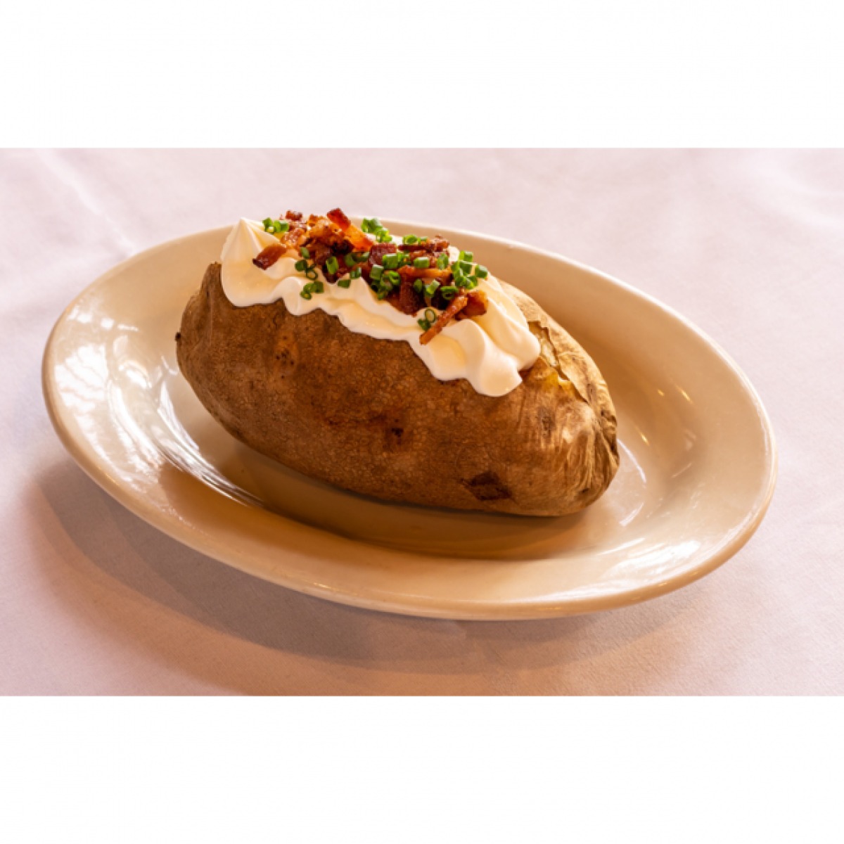 Order Baked Potato food online from LG's Prime Steakhouse store, La Quinta on bringmethat.com