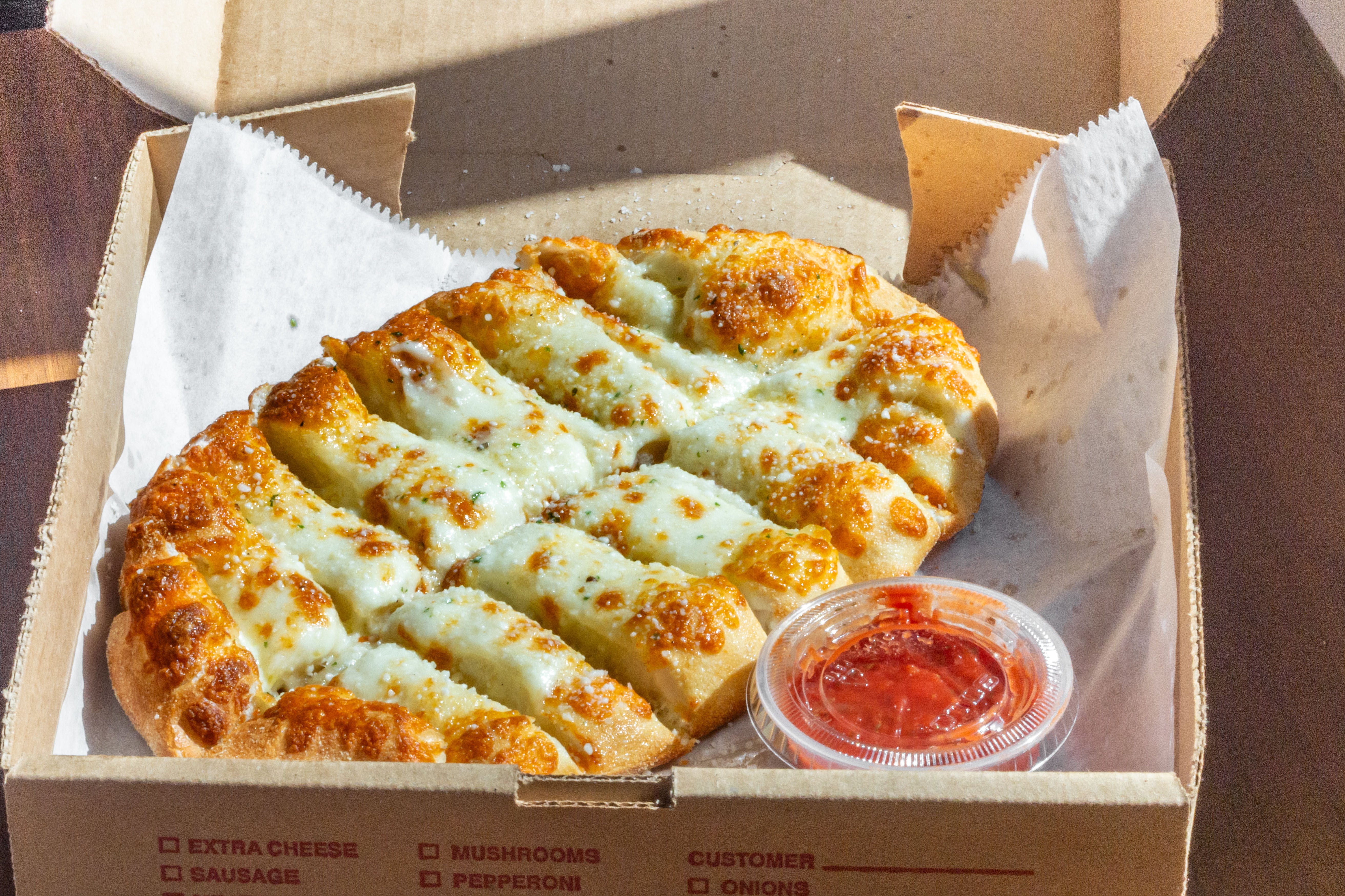Order Cheese Breadsticks - 8 Pieces food online from Pizza On Main store, Washington on bringmethat.com