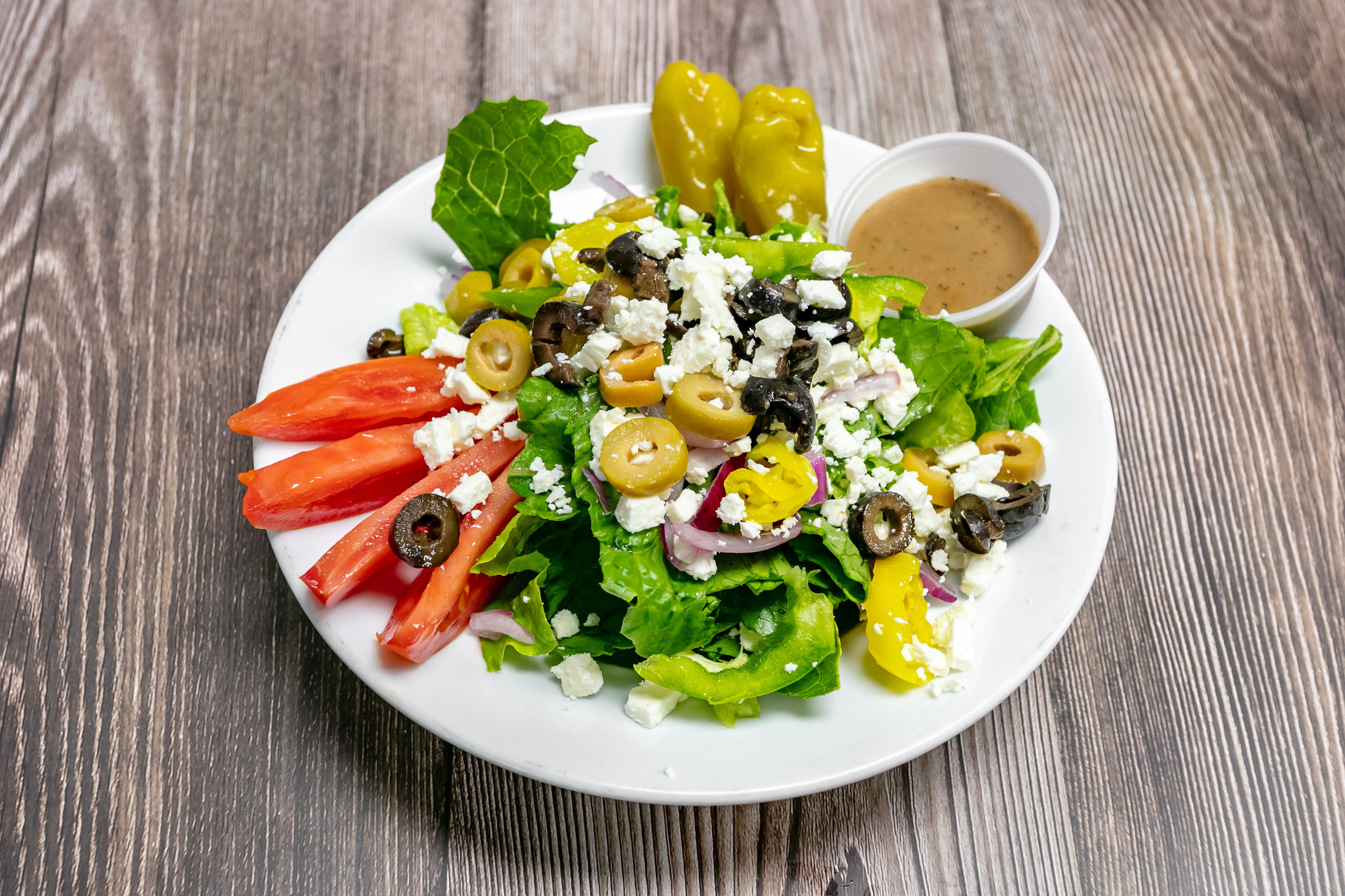 Order Signature Greek God Salad - Small food online from Star Pizza store, Roswell on bringmethat.com
