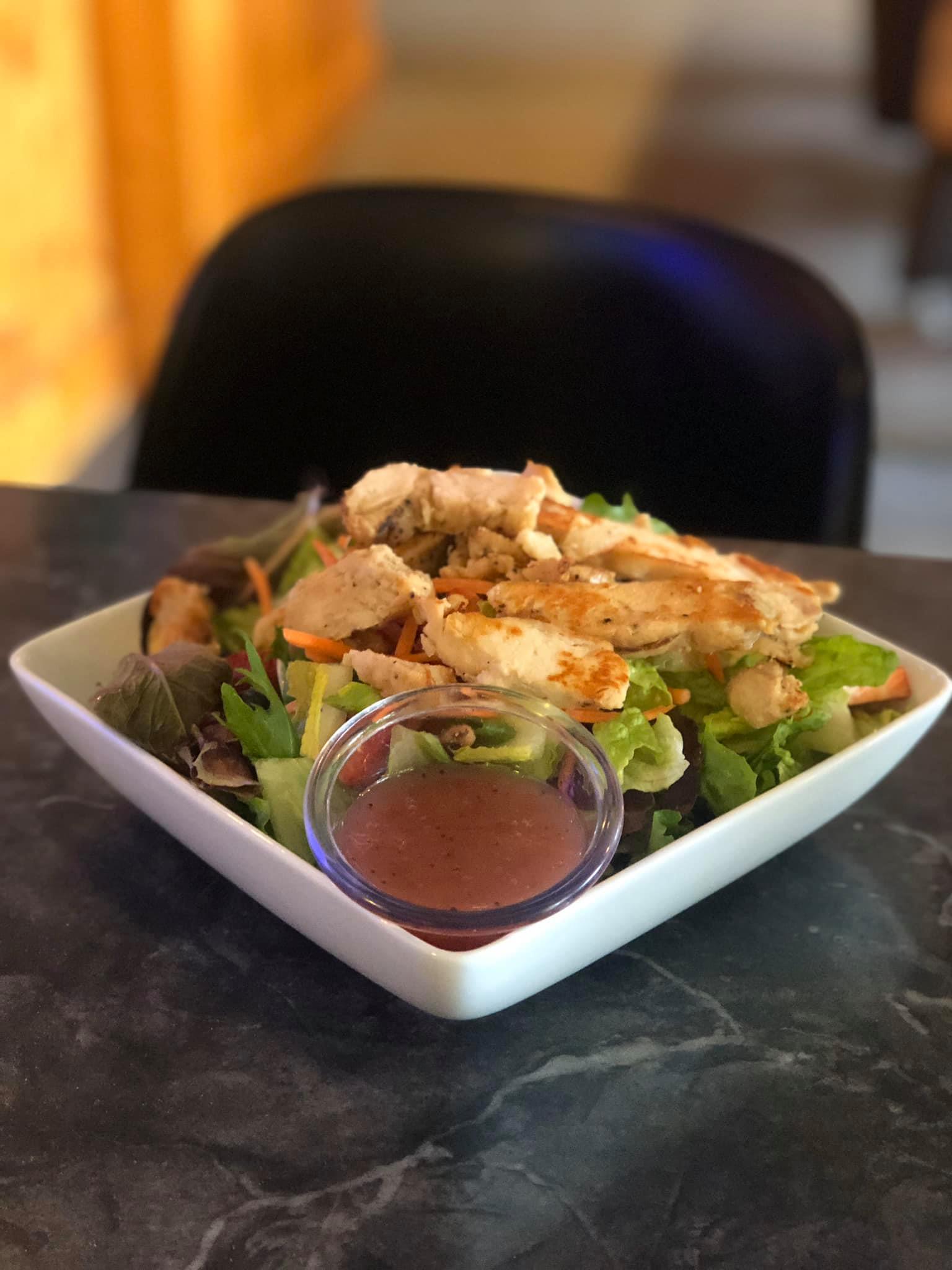 Order Grilled Chicken Caesar Salad food online from The Filling Station Bar & Grill store, Hartford on bringmethat.com
