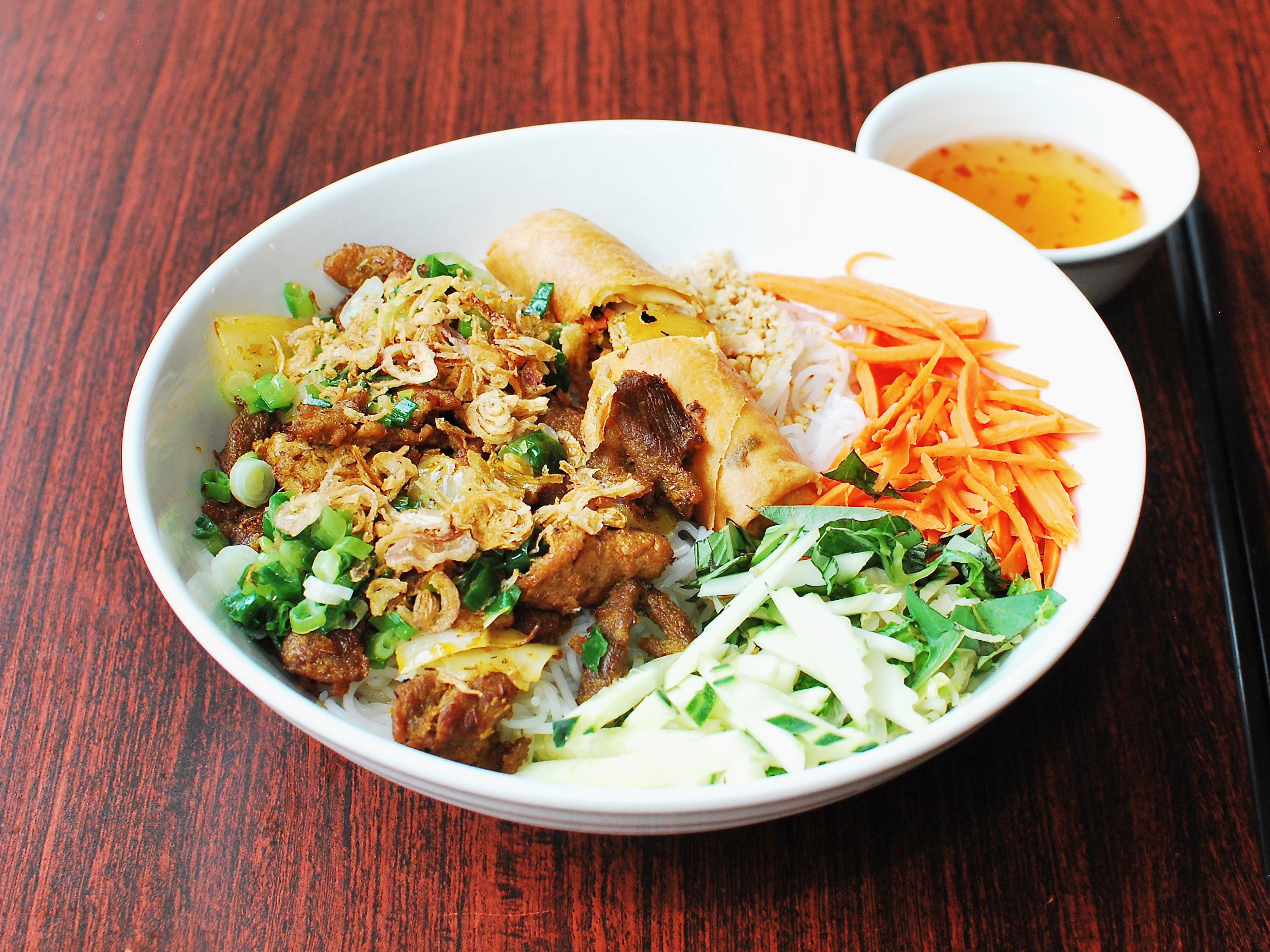 Order 83. Bun Thit Nuong Cha Gio (VERMICELLI NOODLE WITH PORK AND EGG ROLL) food online from Uptown Pho store, Chicago on bringmethat.com