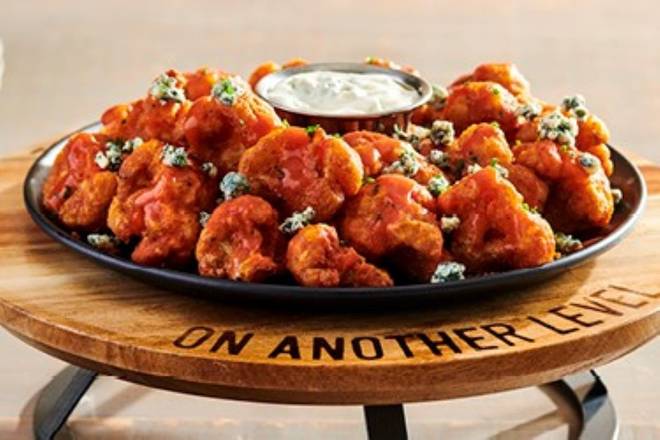 Order NEW!  Buffalo Cauliflower® food online from Outback Steakhouse store, Goldsboro on bringmethat.com