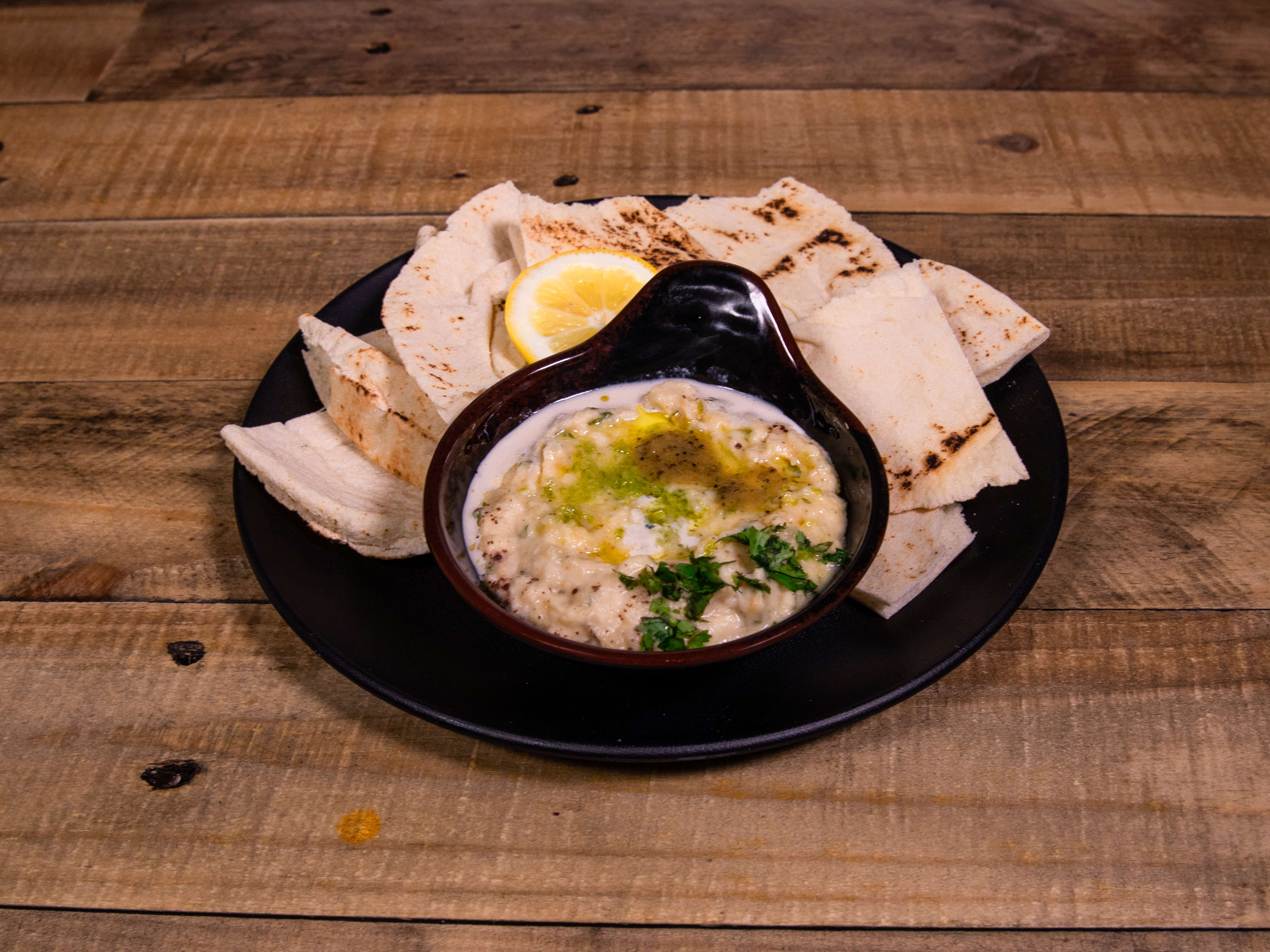 Order Baba Ganuj Dip food online from Mona's Cafe store, New Orleans on bringmethat.com