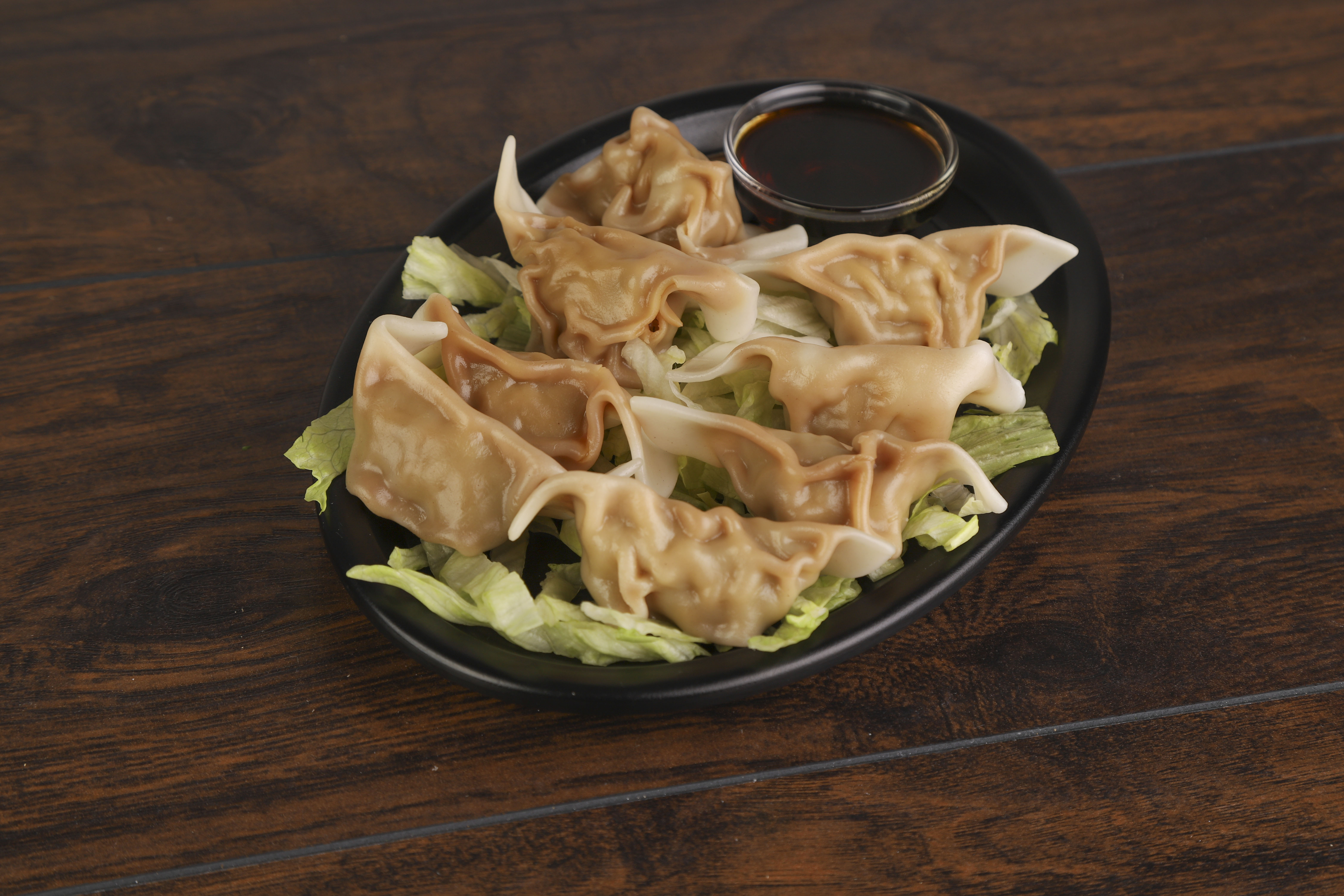 Order 12. Eight Piece Pork Dumpling food online from Ninja Asian Fusion store, Cincinnati on bringmethat.com