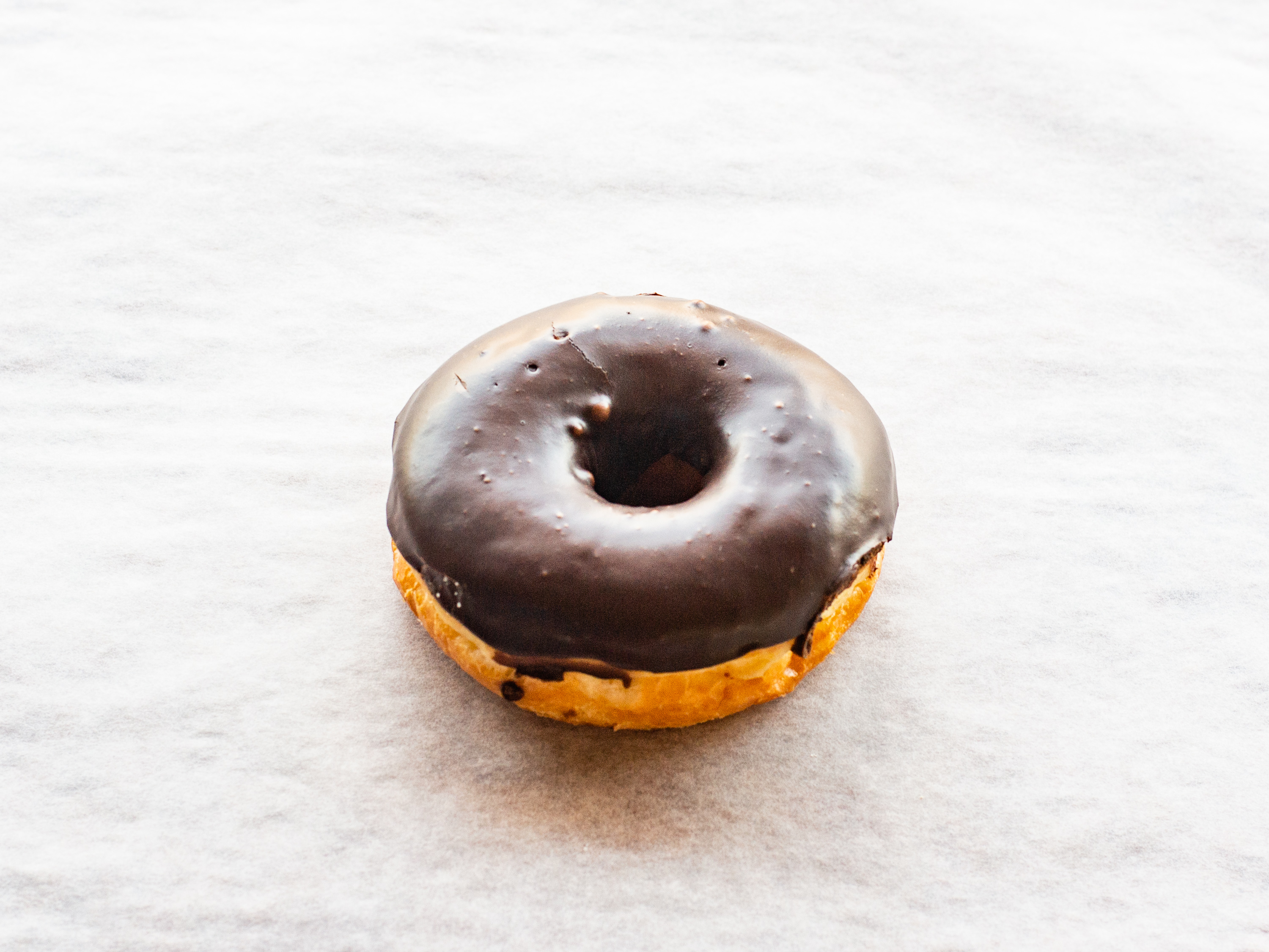 Order Chocolate Icing Raised Doughnut food online from Donuts To Go store, Reedley on bringmethat.com