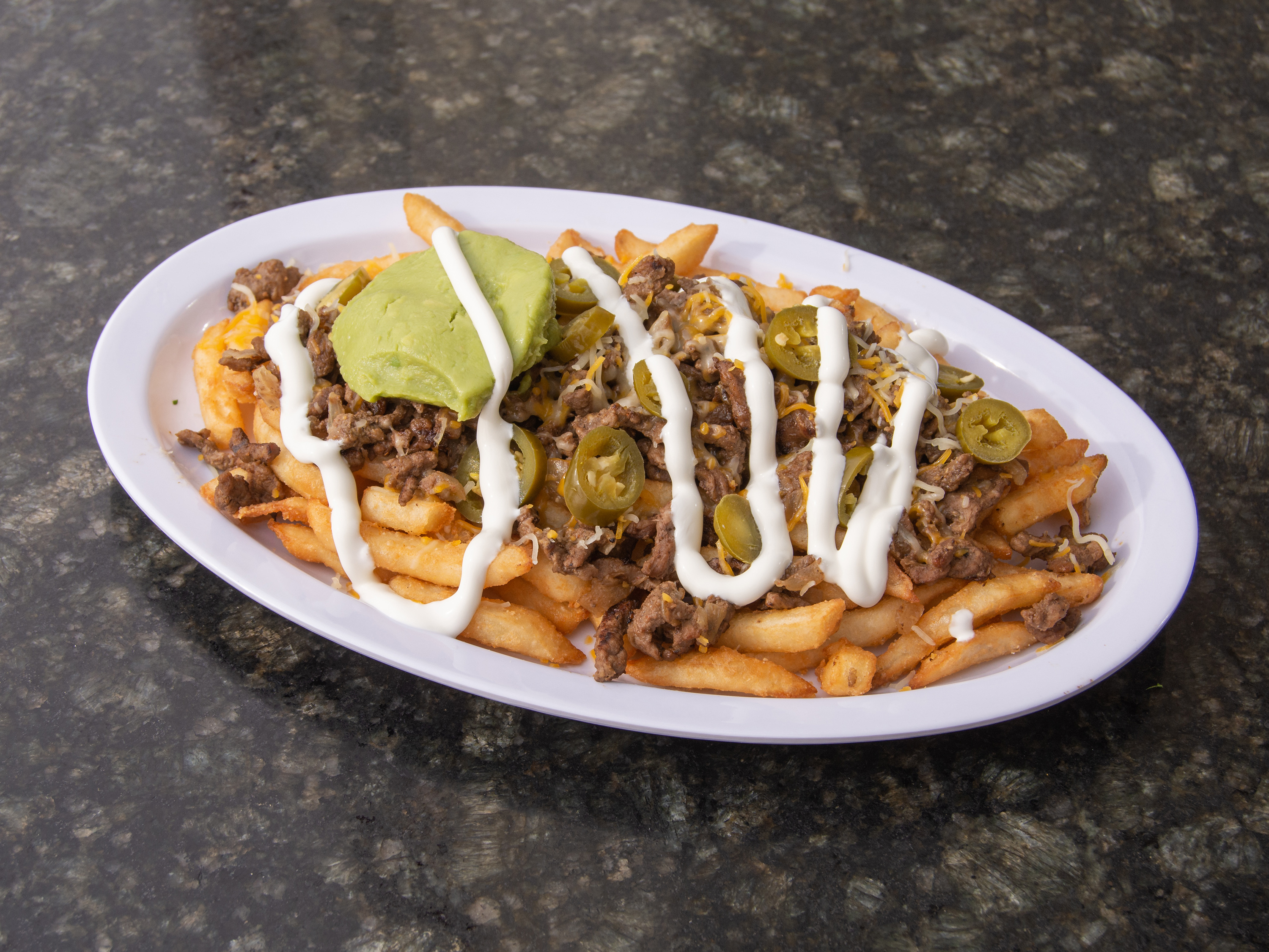 Order Loaded Asada Fries food online from New York Pizza & Grill store, Dinuba on bringmethat.com