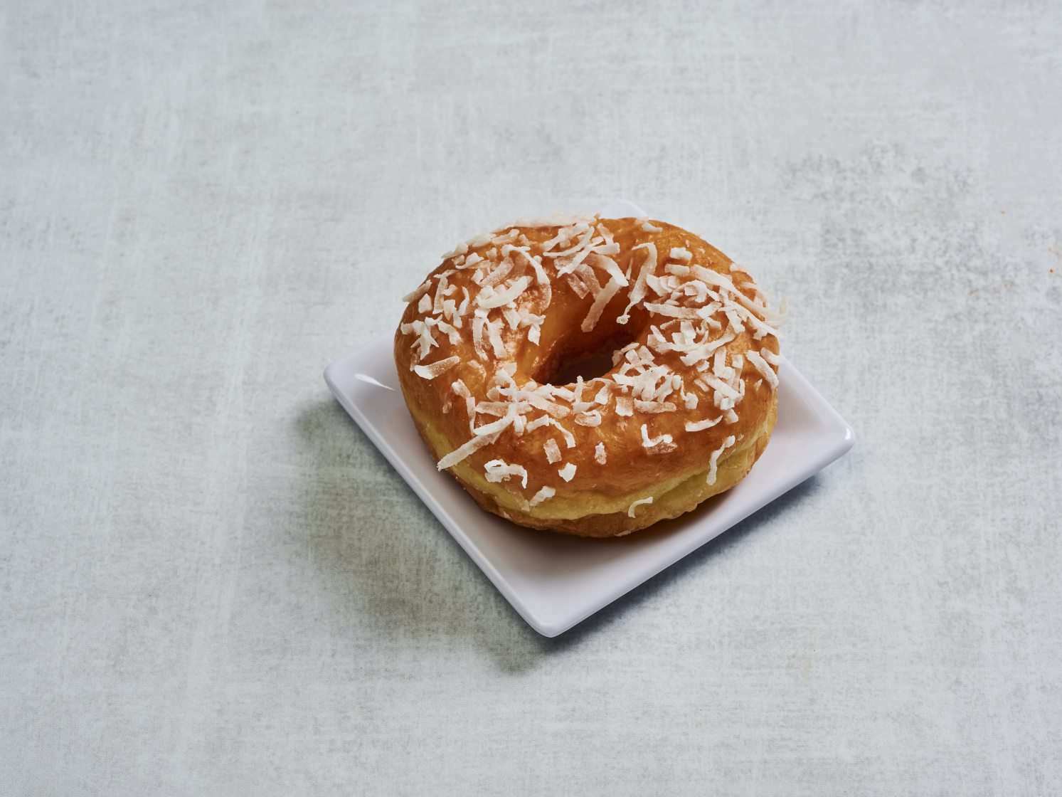Order Coconut Donut food online from Magee Donuts store, Los Angeles on bringmethat.com