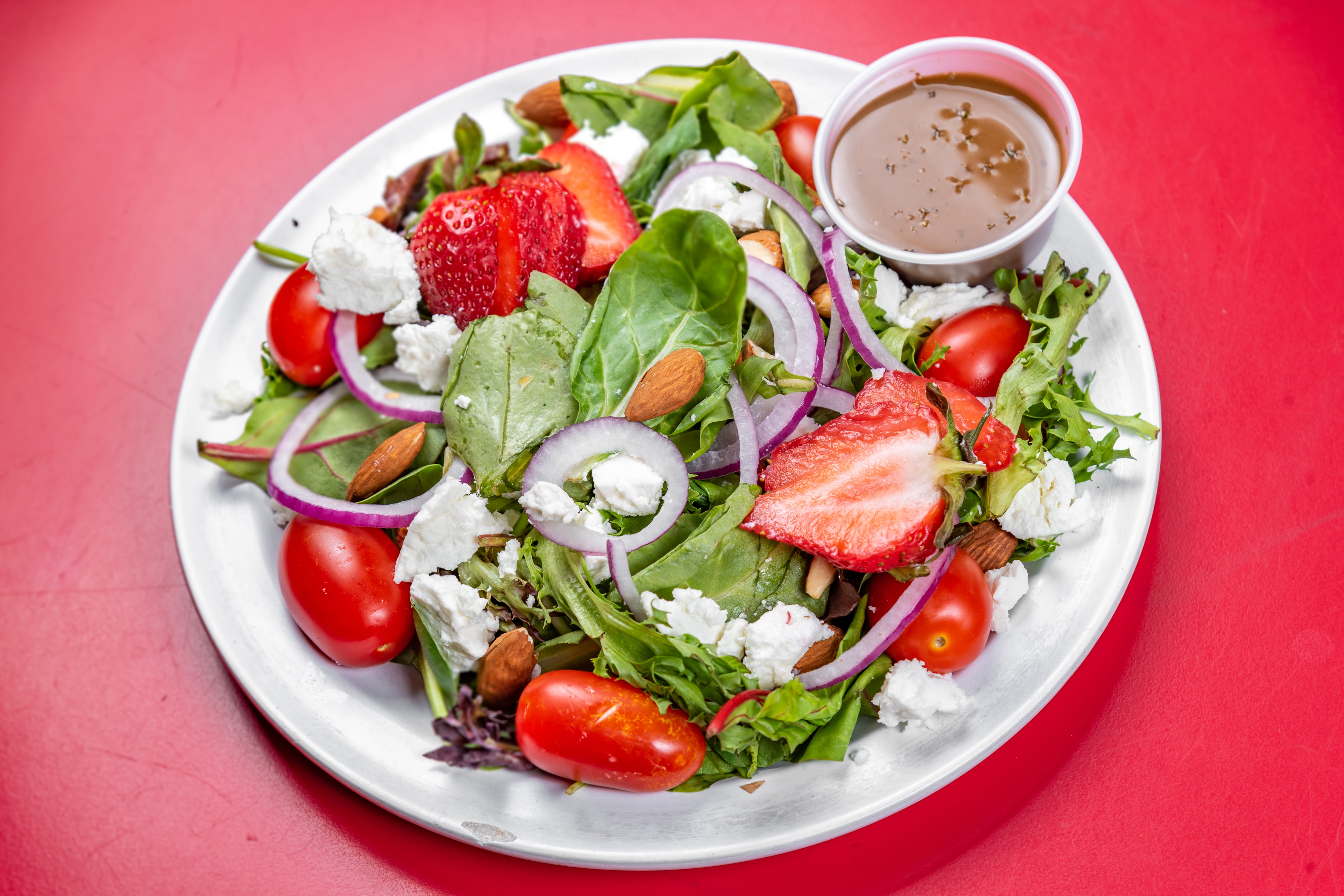 Order Strawberry Goat Cheese Salad - Salad food online from The Grotto Pizzeria store, New York on bringmethat.com