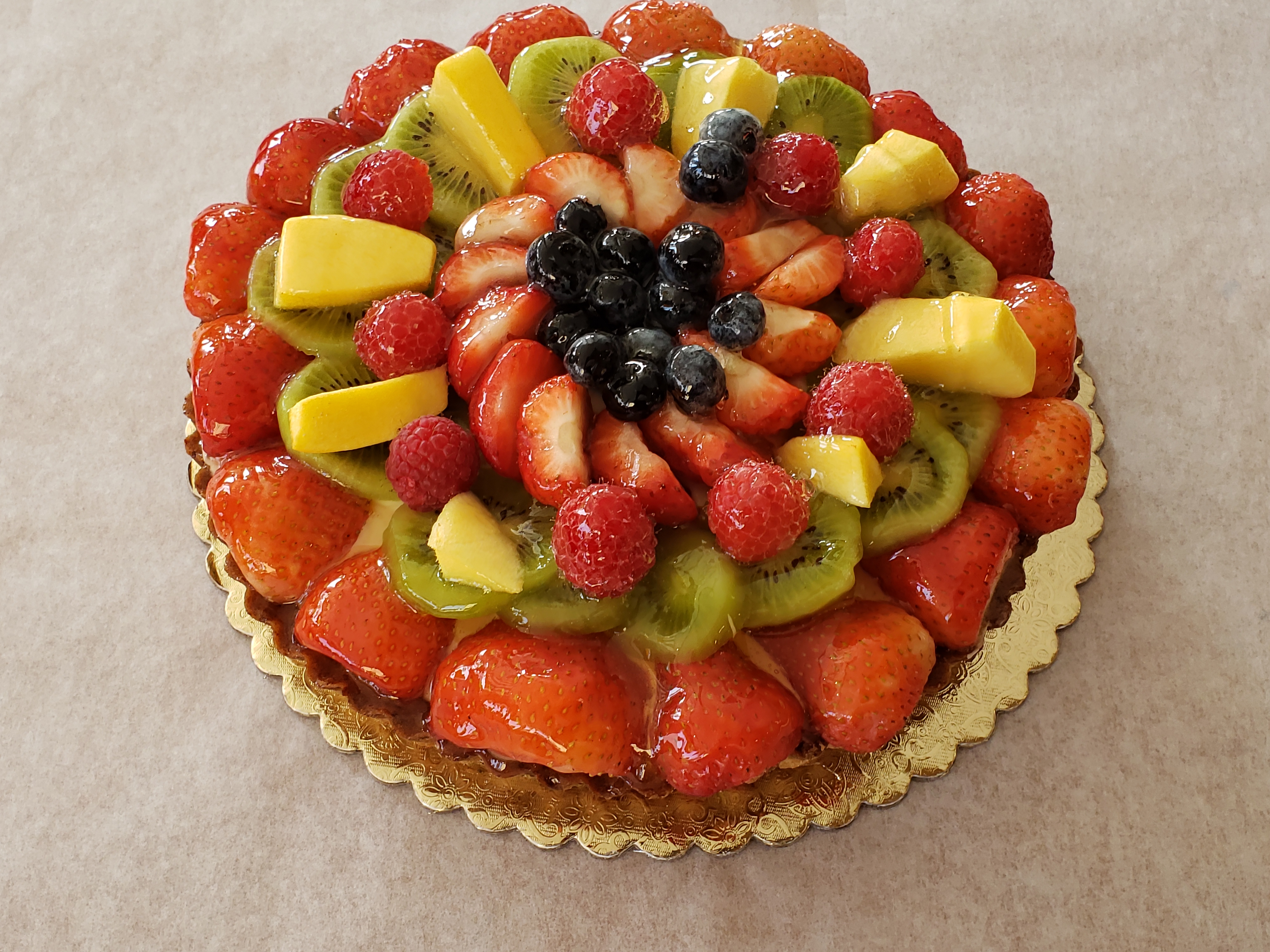 Order 9" Fruit Tart in Almond Shell food online from Vienna Pastry store, Los Angeles on bringmethat.com