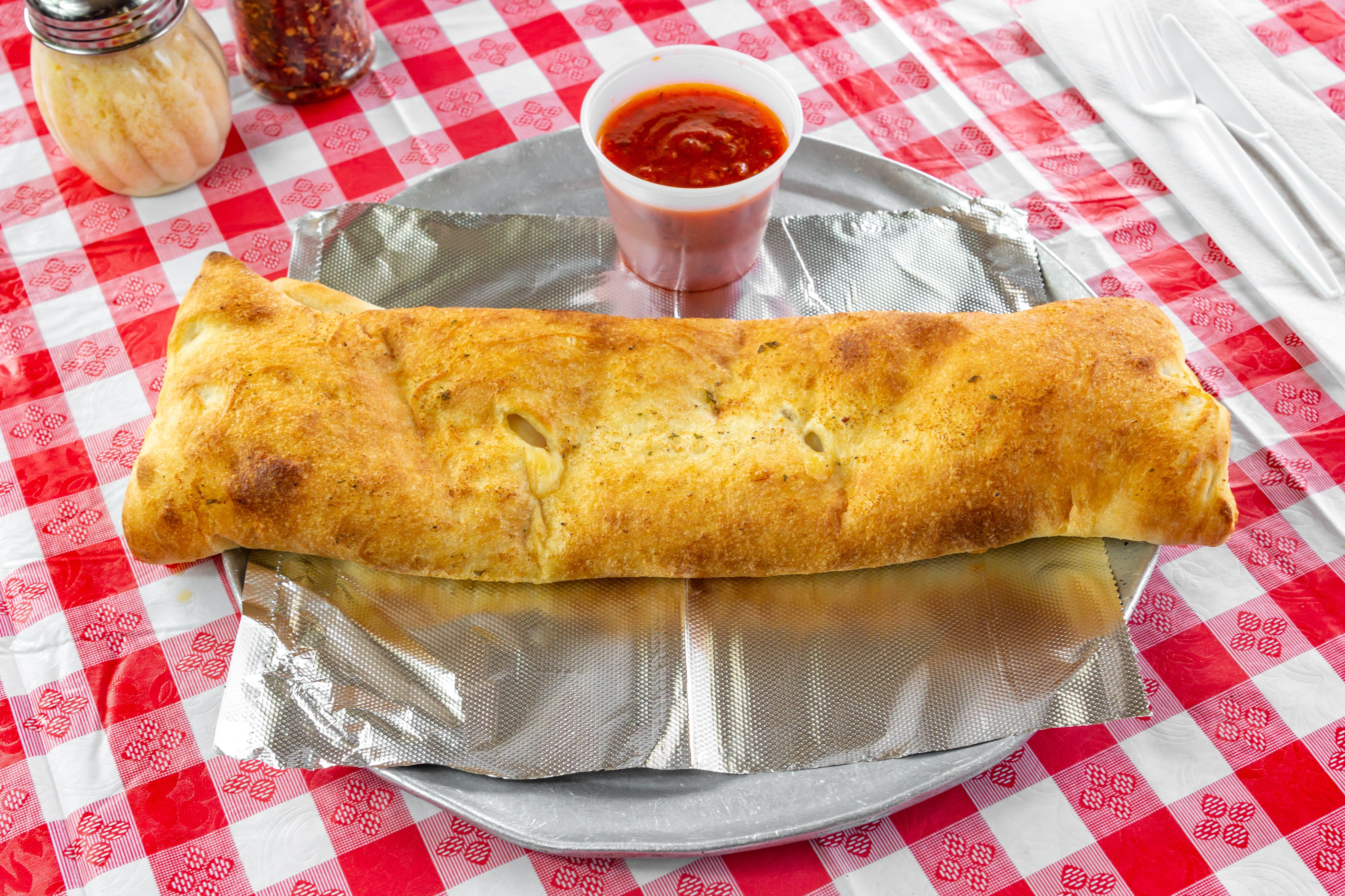 Order Stromboli - Large food online from Pizza Central store, Colonie on bringmethat.com