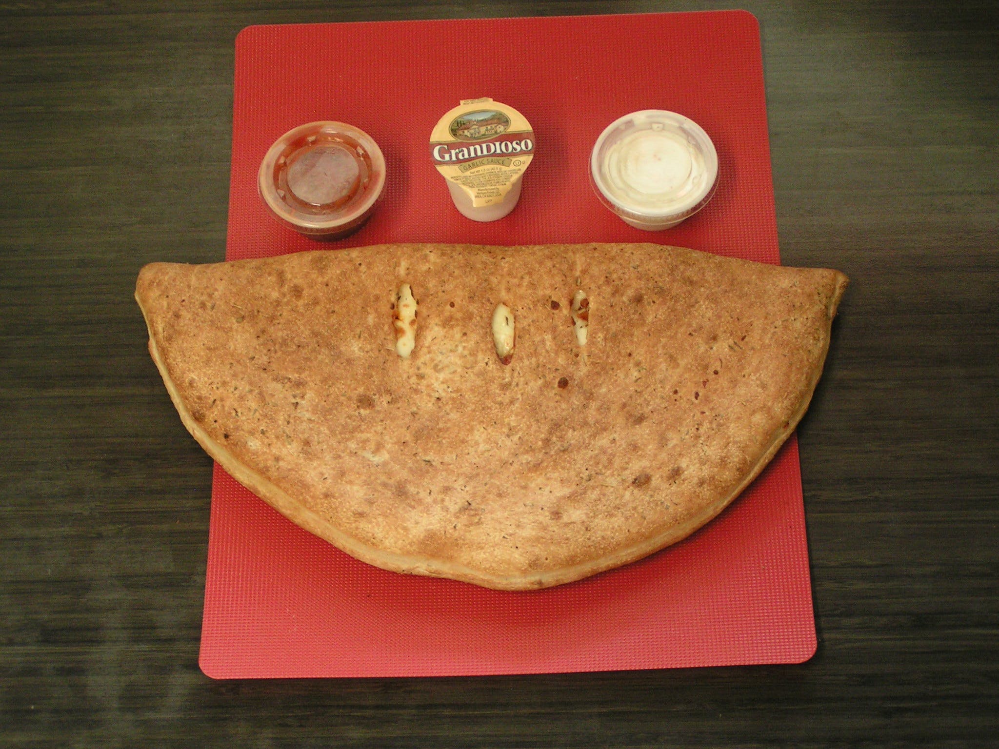 Order CALZONE - SMALL food online from Pepperinos Pizza store, Lewistown on bringmethat.com