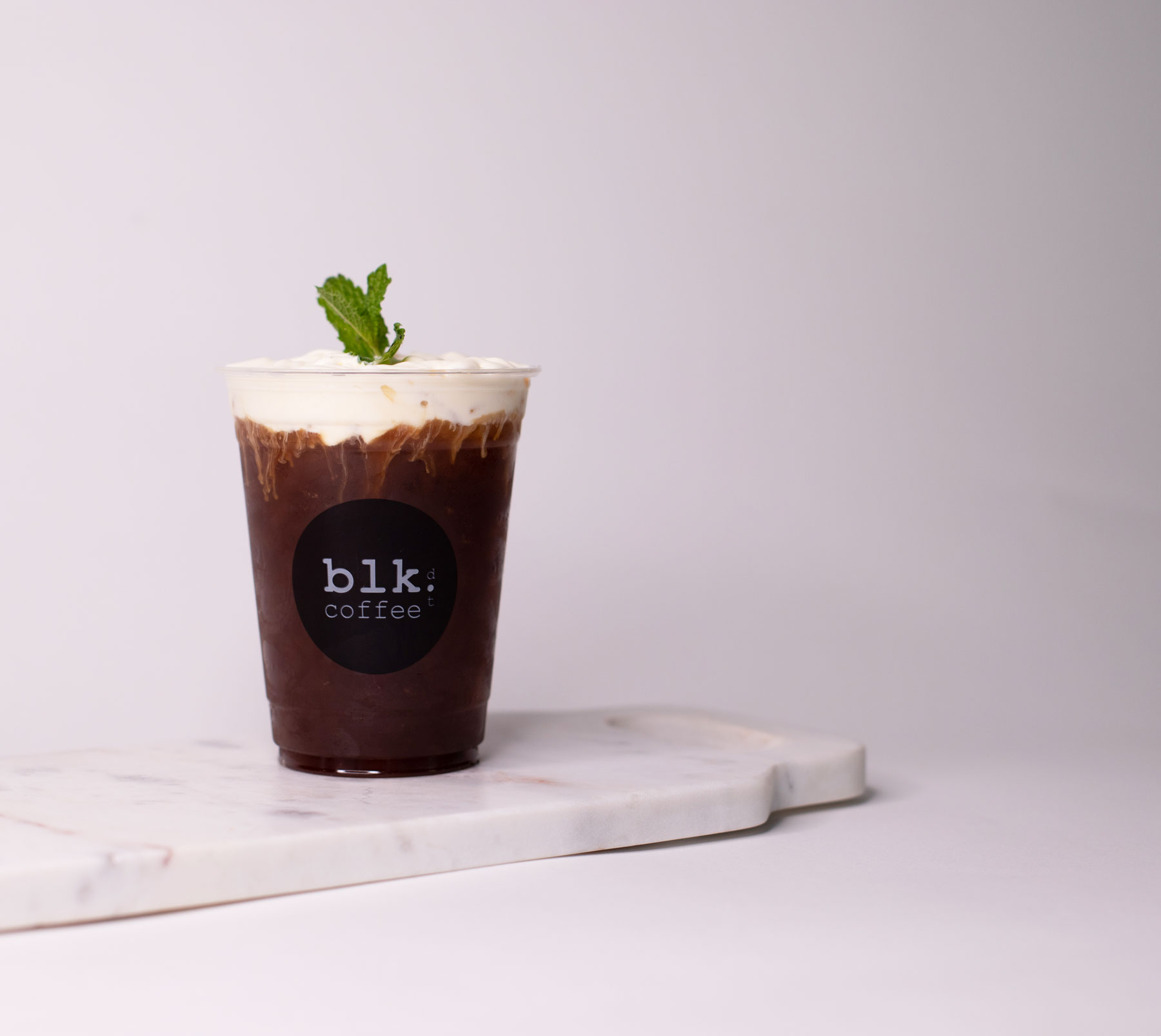Order Iced BLK'nd Mojito Coffee food online from Blk Dot Coffee store, Irvine on bringmethat.com