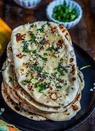 Order Garlic Naan food online from Ruchi Indian Restaurant store, Bellevue on bringmethat.com