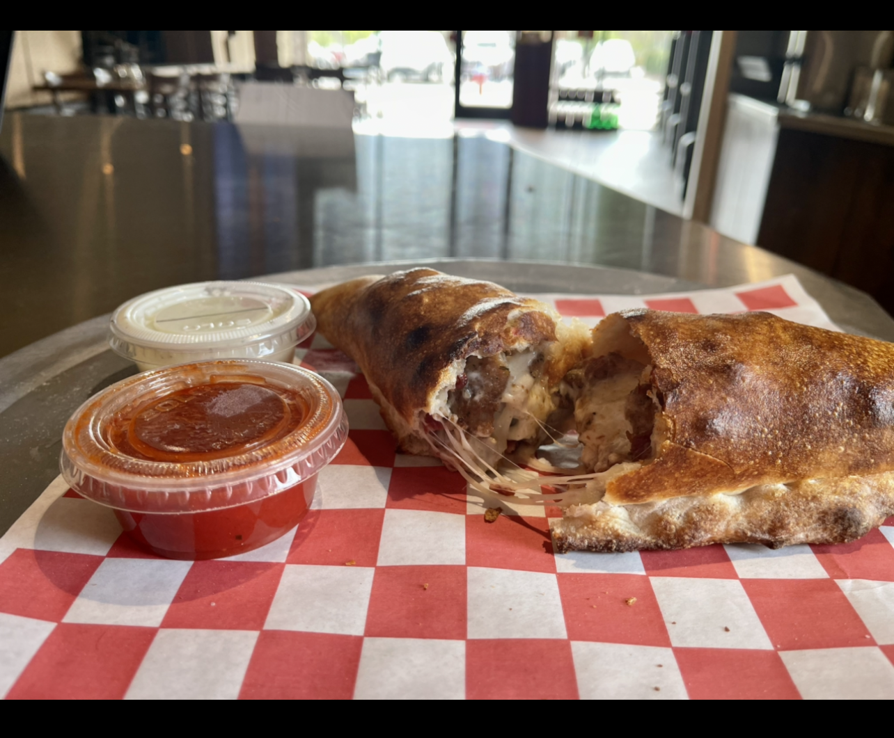 Order Steak and Cheese Stromboli food online from Johnny's Pizza store, Cary on bringmethat.com