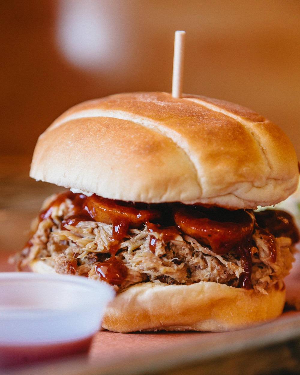 Order Pulled Pork Sandwich food online from All The King Men store, Bryan on bringmethat.com