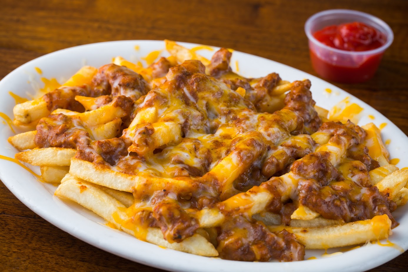 Order Chili Fries with Onions and Cheese food online from Siggys store, Temecula on bringmethat.com