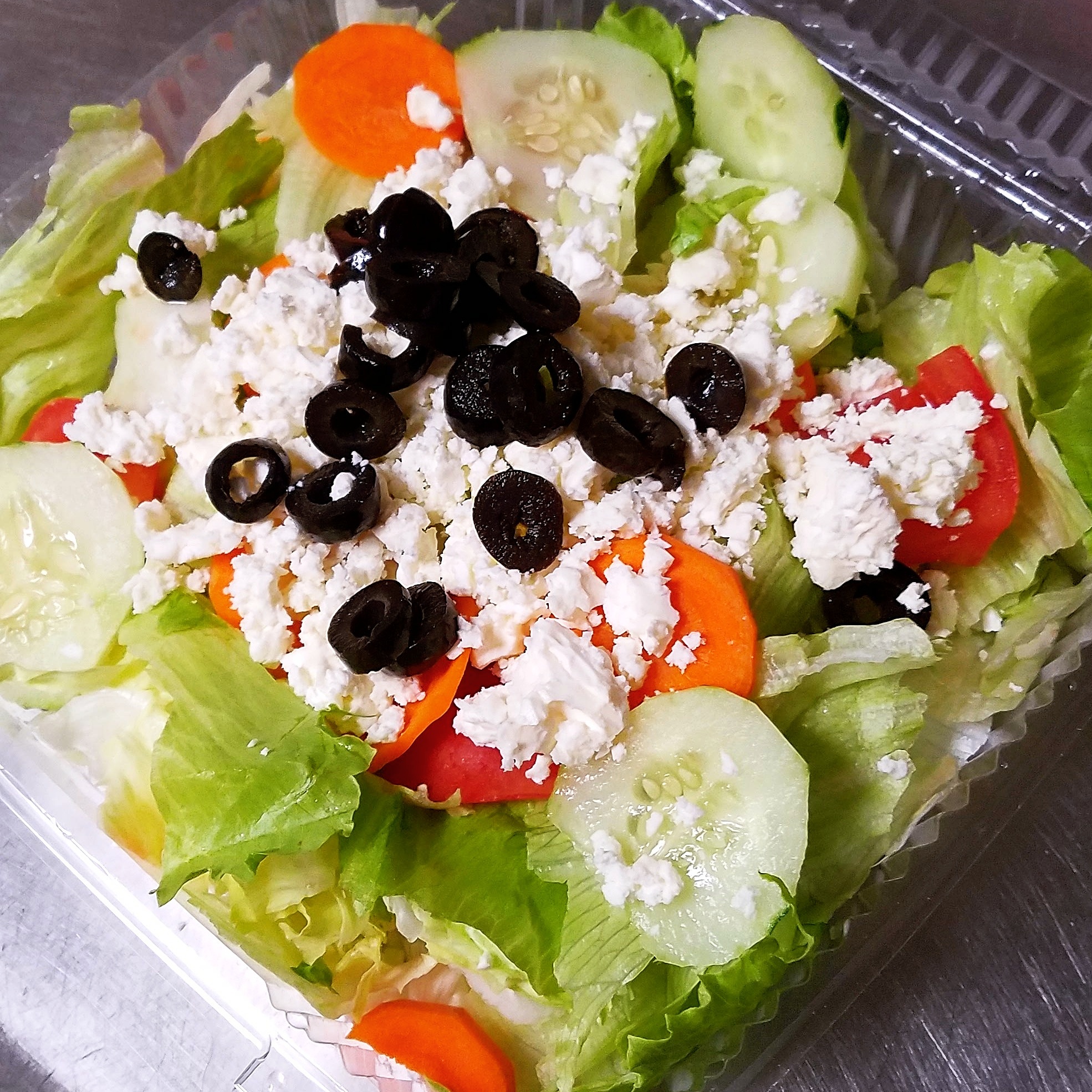 Order Greek Salad food online from Nino's Pizza store, Boston on bringmethat.com