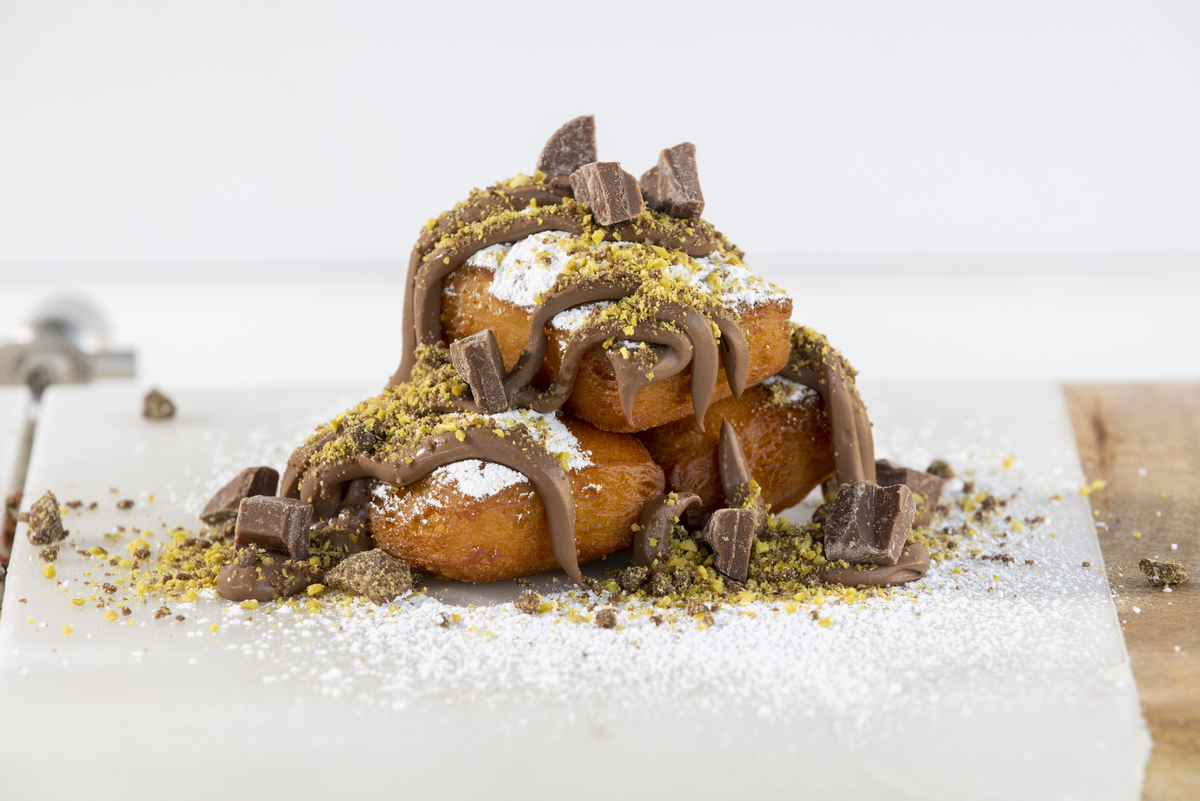 Order Chocolate and Pistachio Beignet food online from Benyeh store, Las Vegas on bringmethat.com