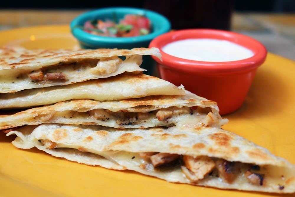 Order Quesadilla De Pollo food online from Mad Dog And Beans store, New York on bringmethat.com