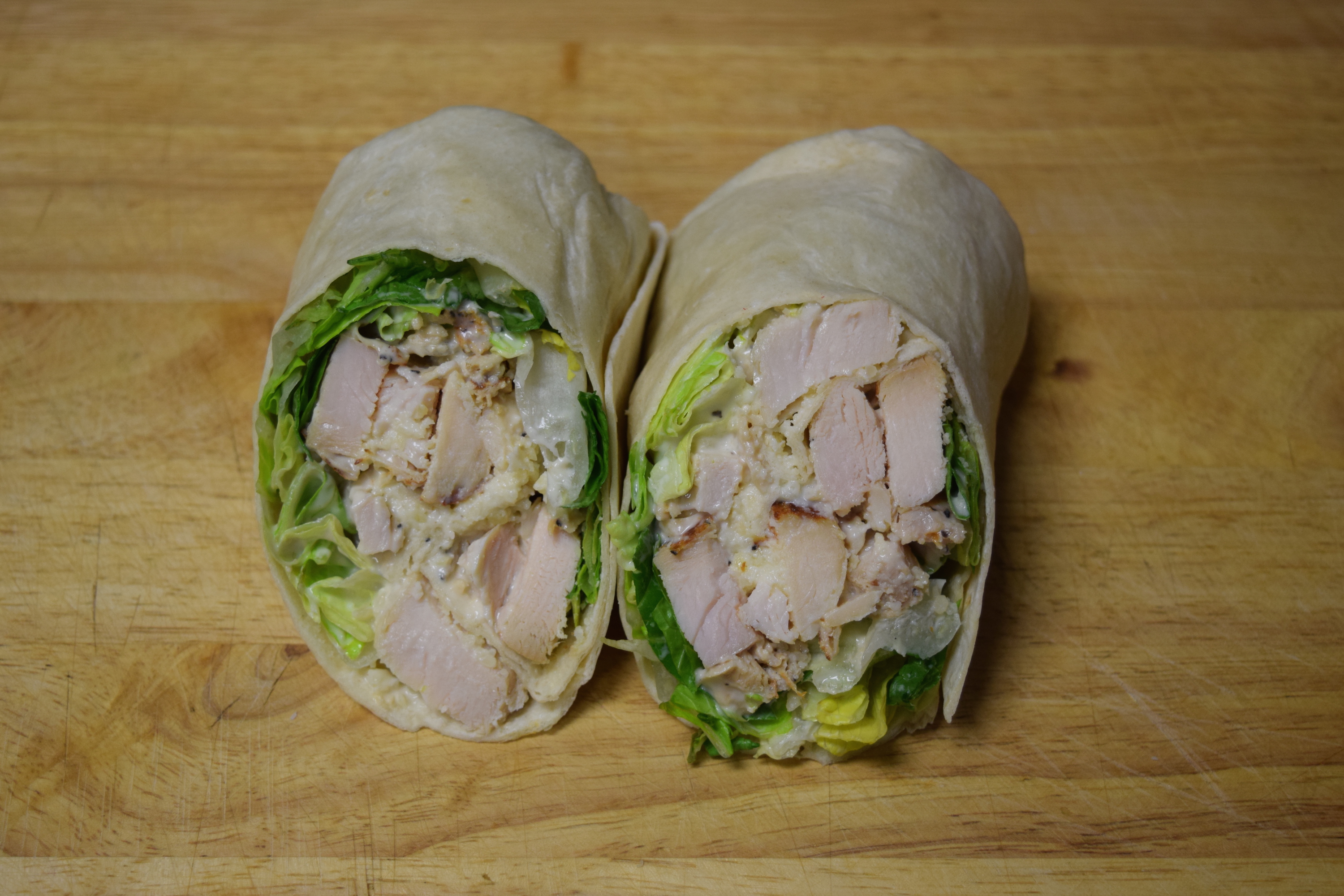 Order Chicken Caesar Wrap food online from Cuzino Pizza & Pasta store, North East on bringmethat.com
