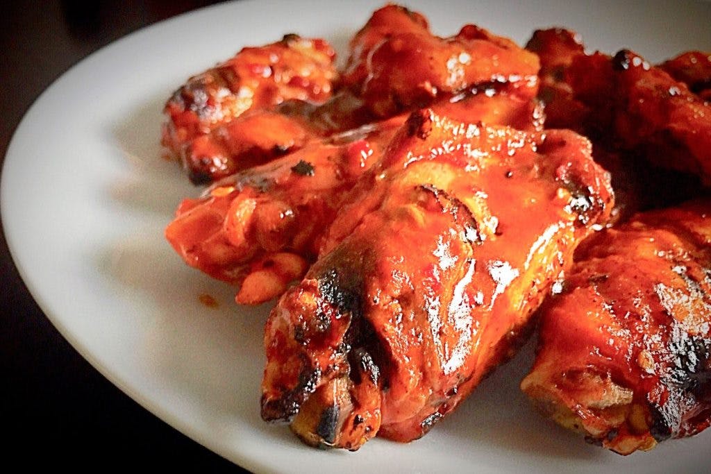 Order Naked Buffalo Wings - 10 Pieces food online from Alba Pizza store, Browns Mills on bringmethat.com