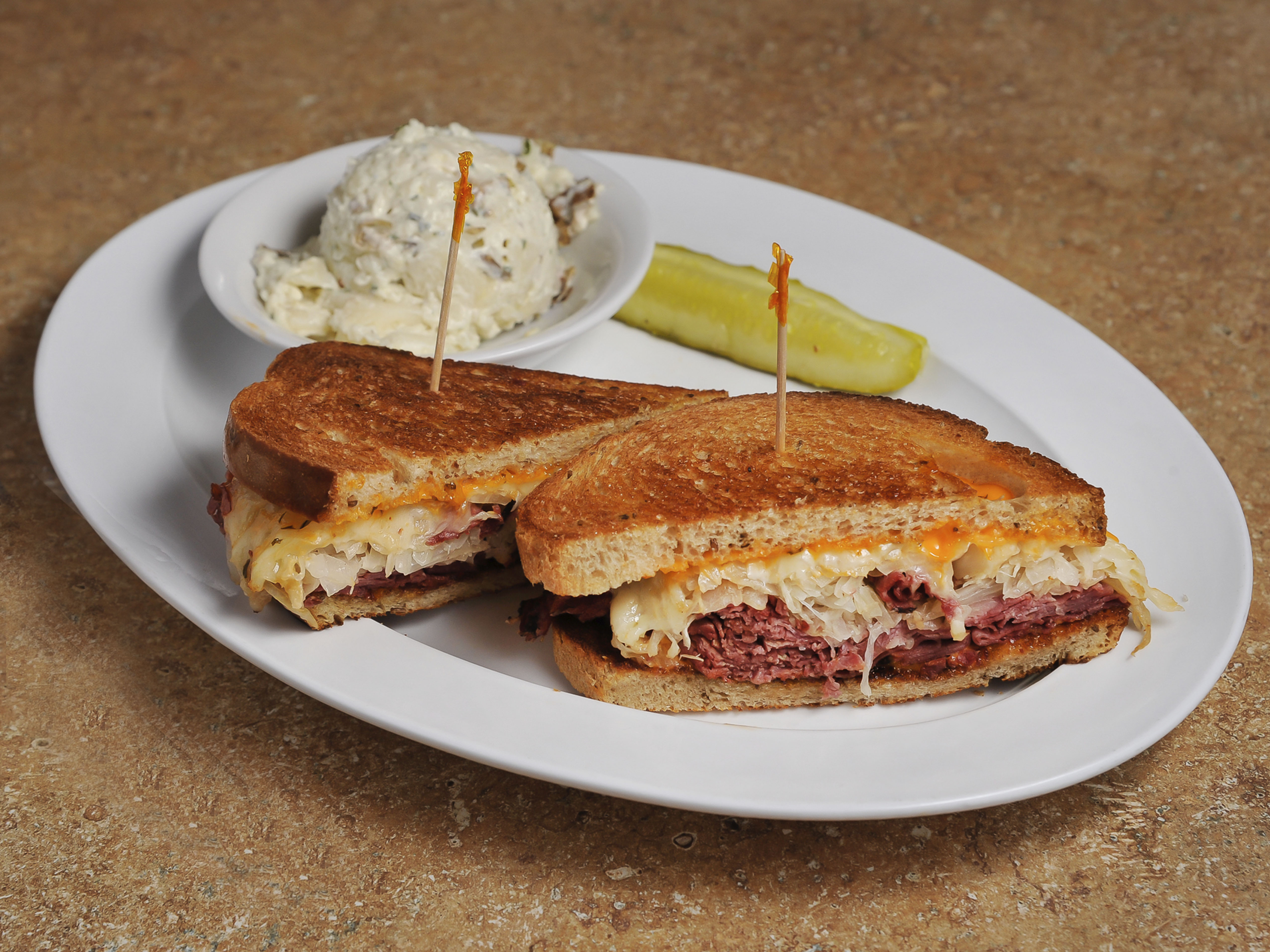 Order Our Famous Grilled Reuben Sandwich food online from Manhattan Ny Deli And Bagel store, Norcross on bringmethat.com