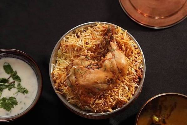 Order Hyderabadi Chicken Dum Biryani food online from Nala’S Indian Restaurant store, Austin on bringmethat.com