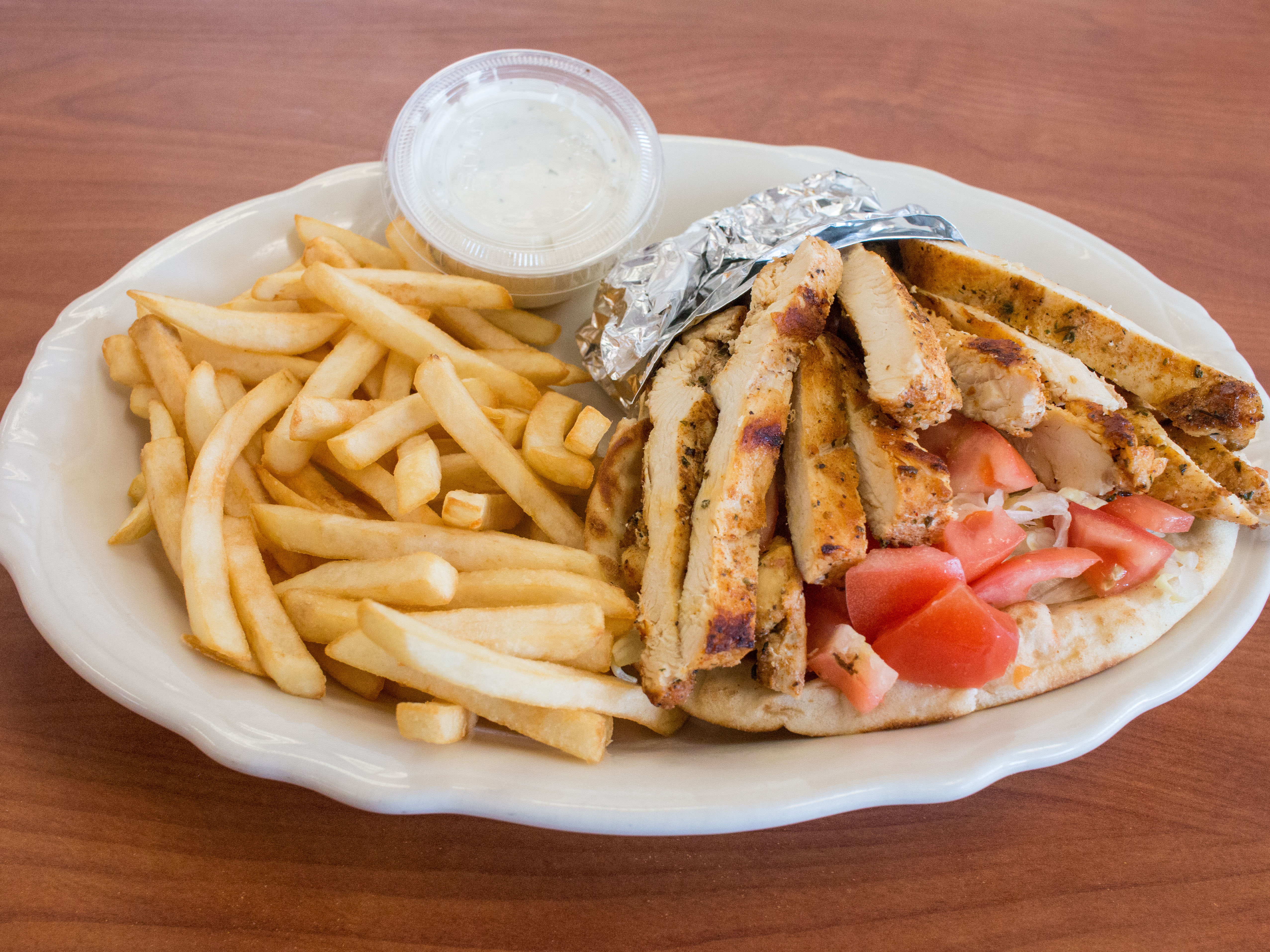Order Grilled Chicken Pita Deluxe food online from Olympic Grill store, Center Line on bringmethat.com