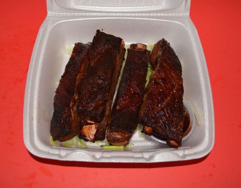 Order P9. Four Piece BBQ Pork Ribs food online from Canton Express store, Plano on bringmethat.com