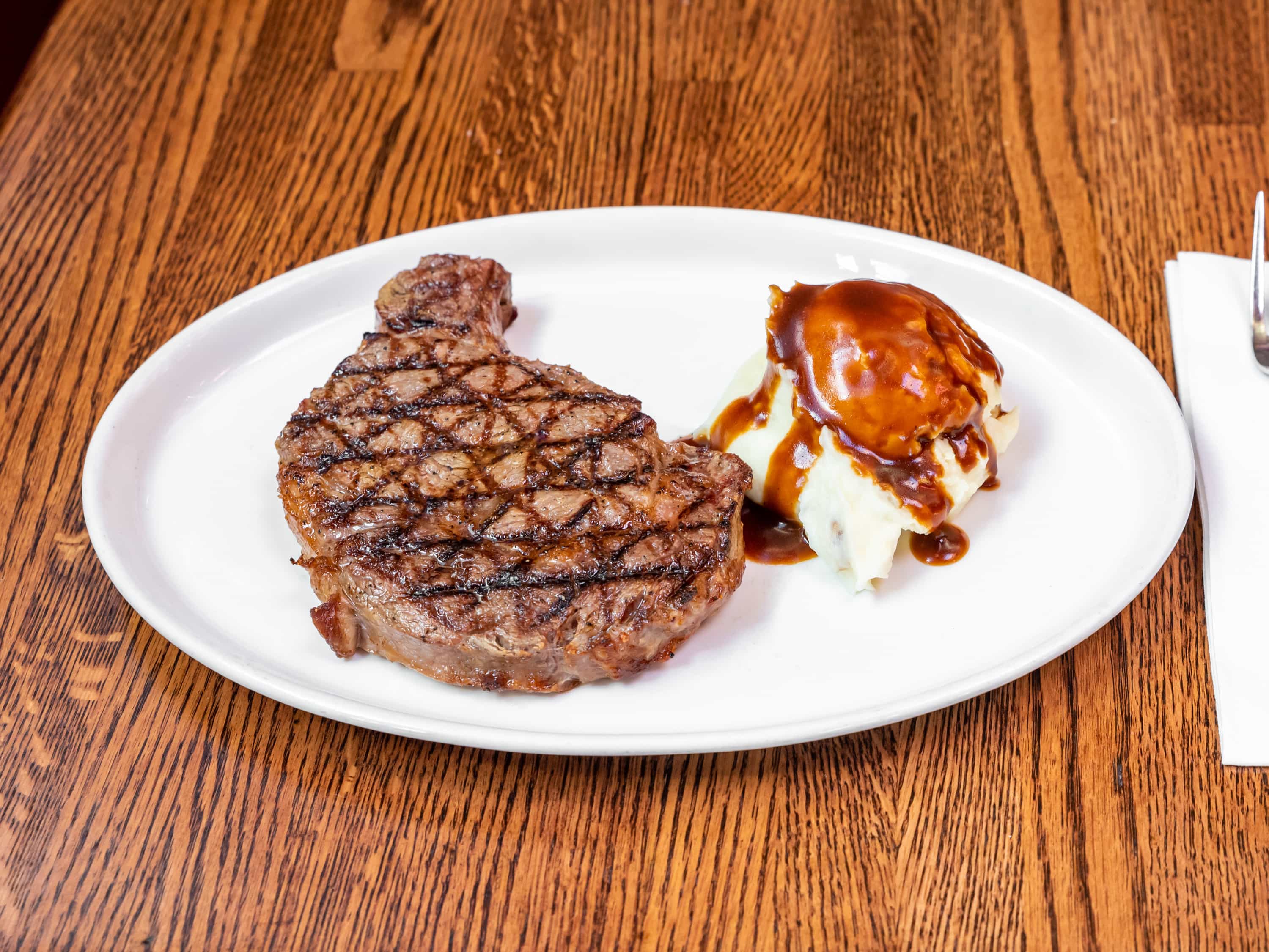 Order Rib Eye Steak food online from P.J. Skidoos store, Fairfax on bringmethat.com