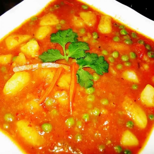 Order Aloo Matar food online from India's Grill store, Los Angeles on bringmethat.com
