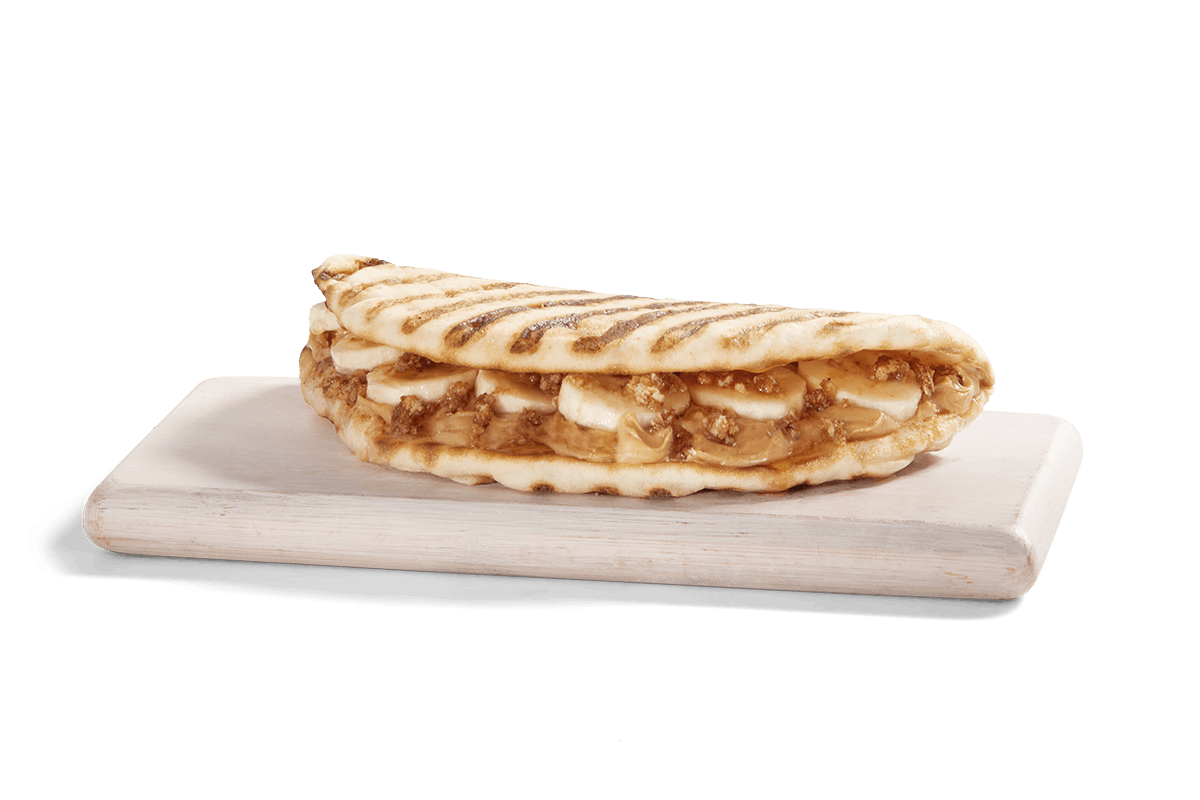 Order PEANUT BUTTER BANANA CRUNCH FLATBREAD food online from Tropical Smoothie Cafe store, Providence on bringmethat.com