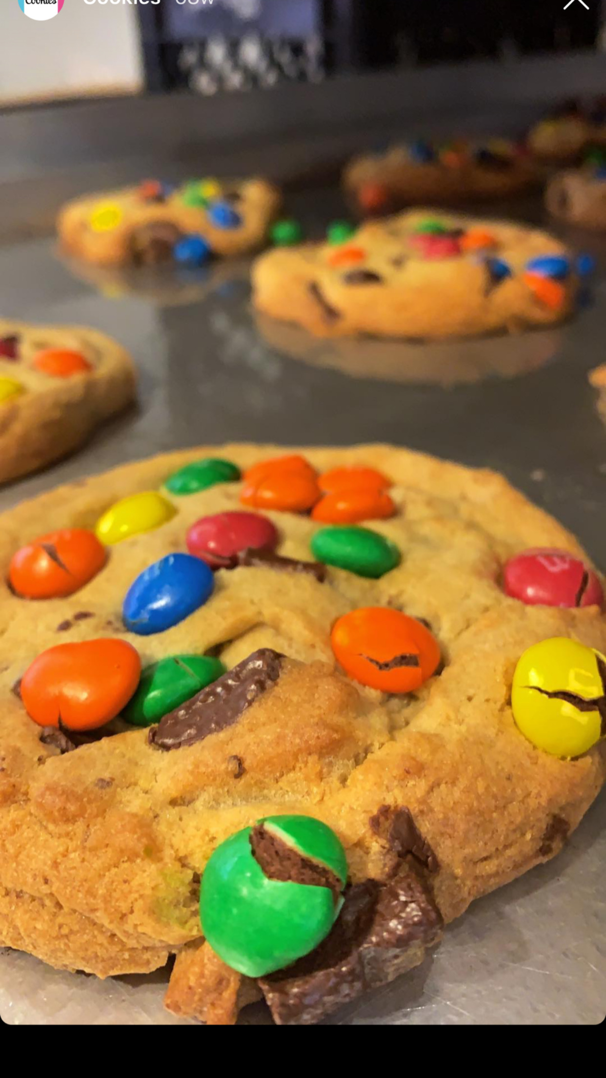 Order M&M Colossal Size Cookie food online from Colossal Cupcakes store, Cleveland on bringmethat.com