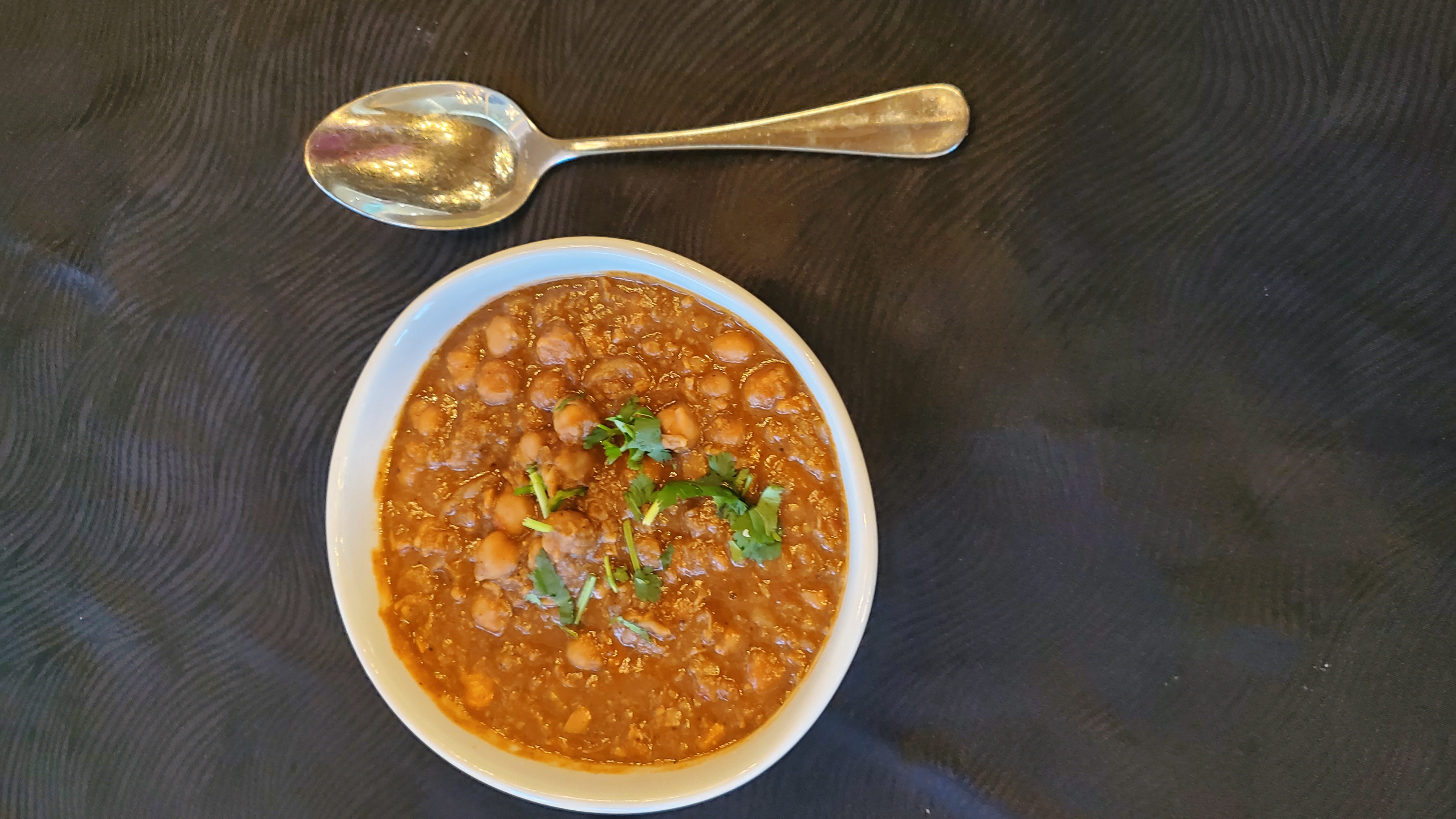Order Chana Masala (16 oz)  food online from Annapoorna Restaurant store, Milpitas on bringmethat.com