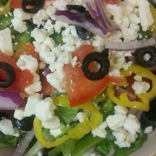 Order Greek Salad food online from Pisanello's Pizza store, Bowling Green on bringmethat.com