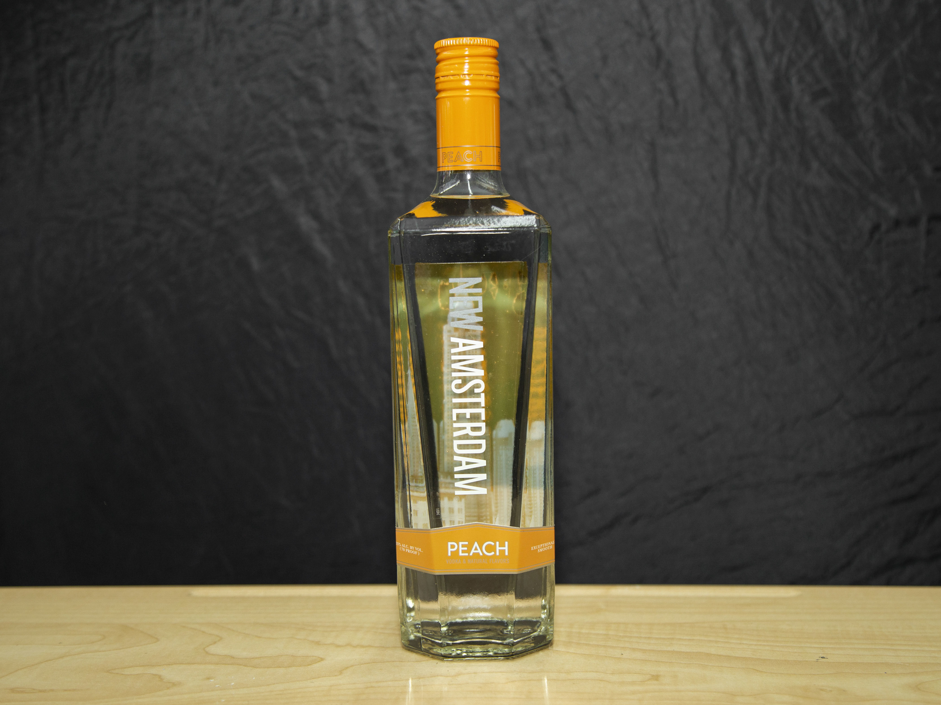Order New Amsterdam Peach Flavored, 750 ml. Vodka (35.0% ABV) food online from Platinum Star Food & Liquor store, Chicago on bringmethat.com