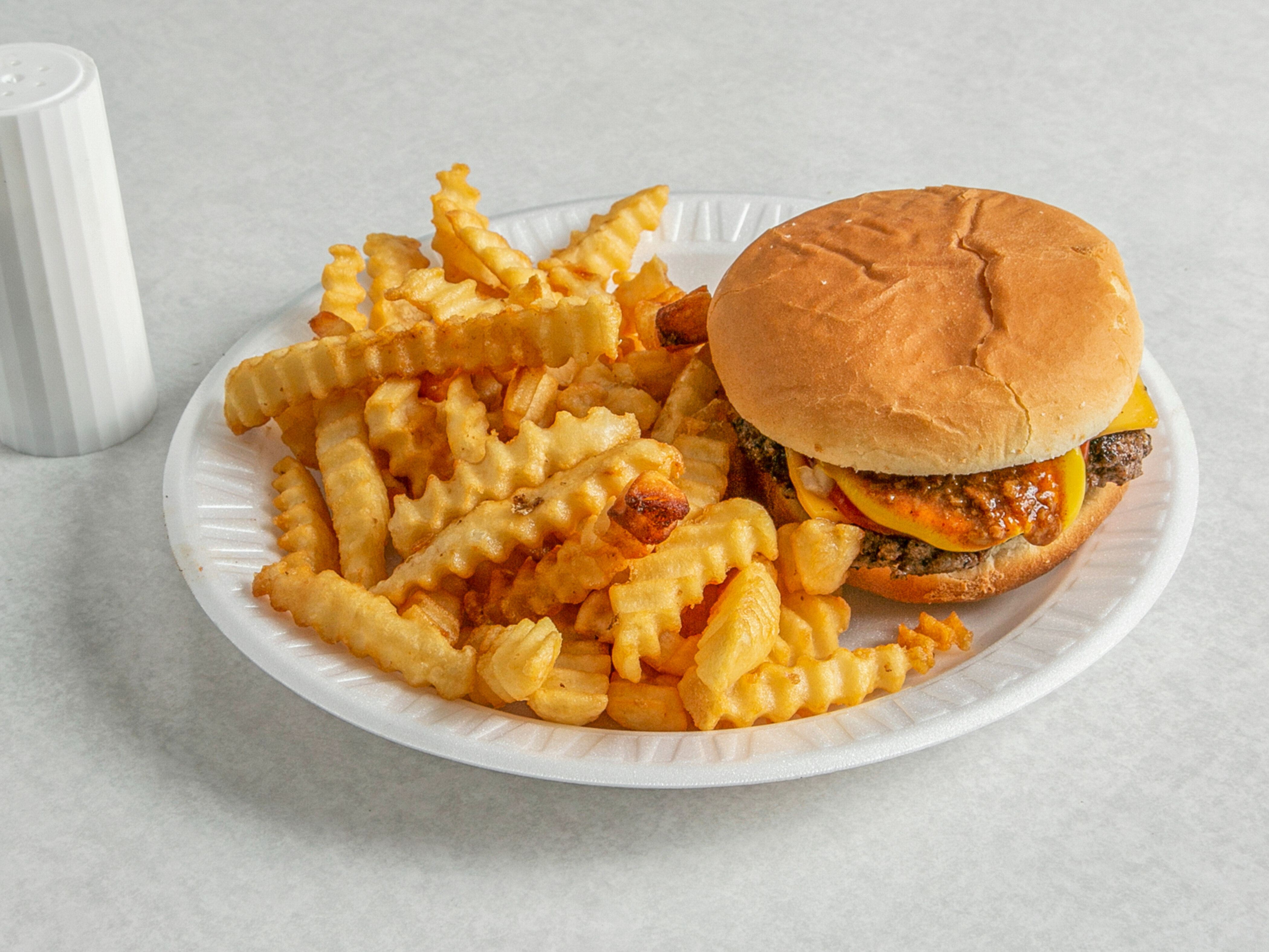 Order CHEESEBURGER WITH FRIES AND REGULAR DRINK food online from Edwards Pharmacy store, Ayden on bringmethat.com