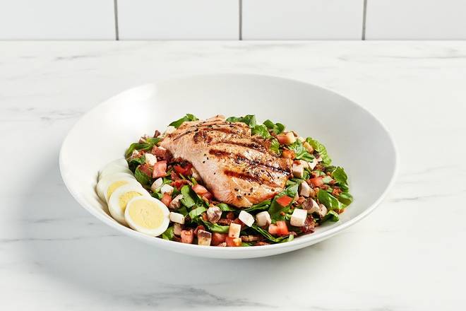 Order Spinach and Salmon Salad* food online from Firebirds Wood Fired Grill store, Raleigh on bringmethat.com