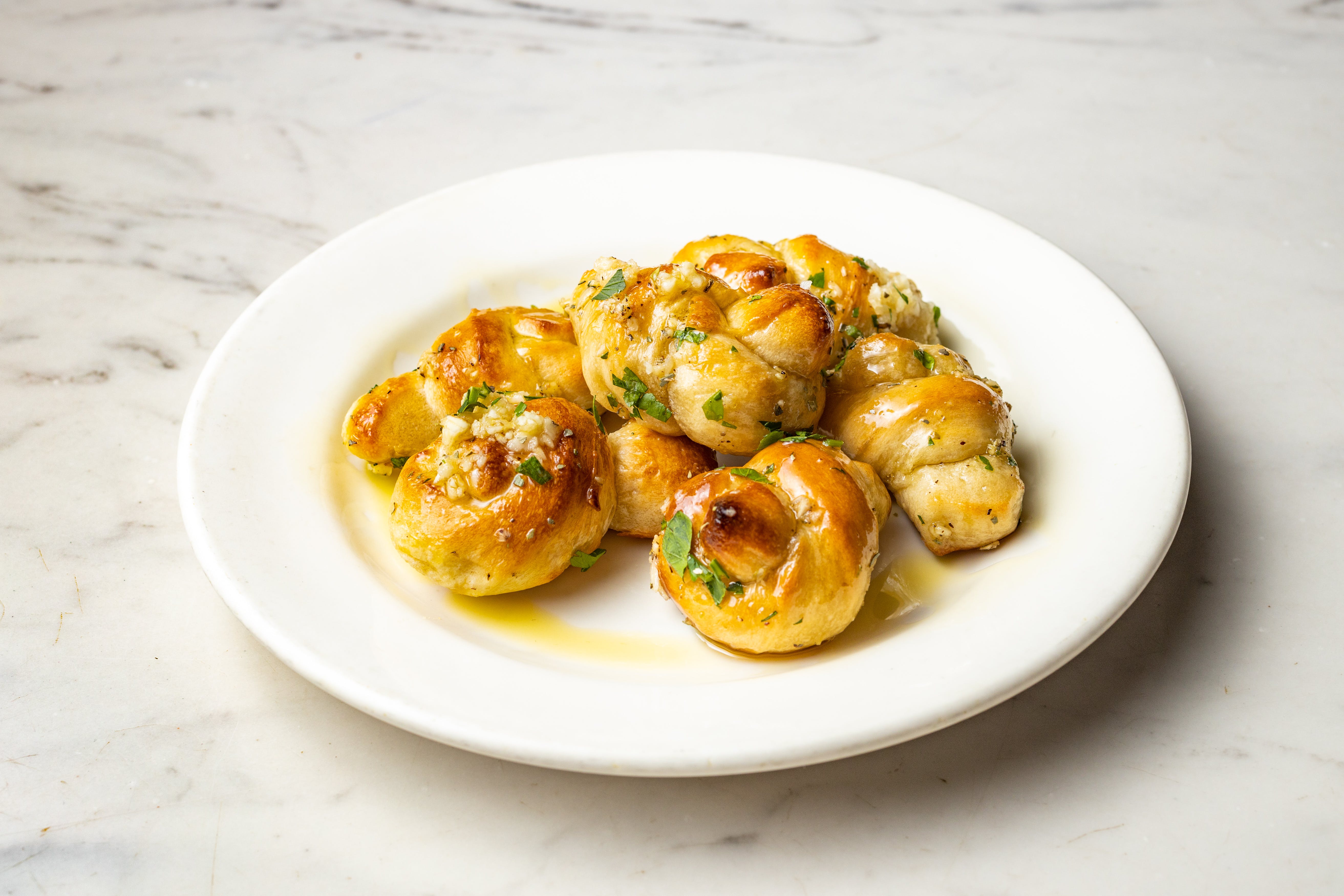 Order Garlic Knots - 6 Pieces food online from Graziella Pizza store, Flushing on bringmethat.com