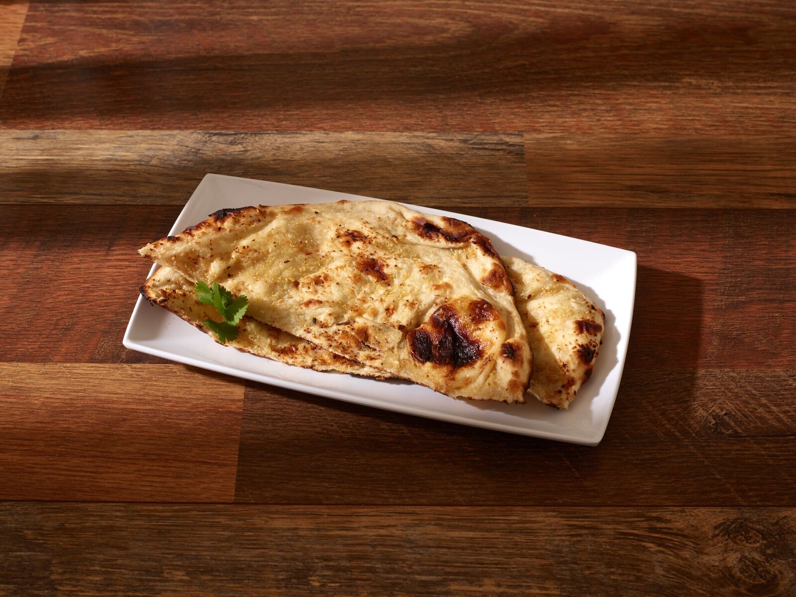 Order Garlic Naan food online from Punjabi Tandoor store, Anaheim on bringmethat.com