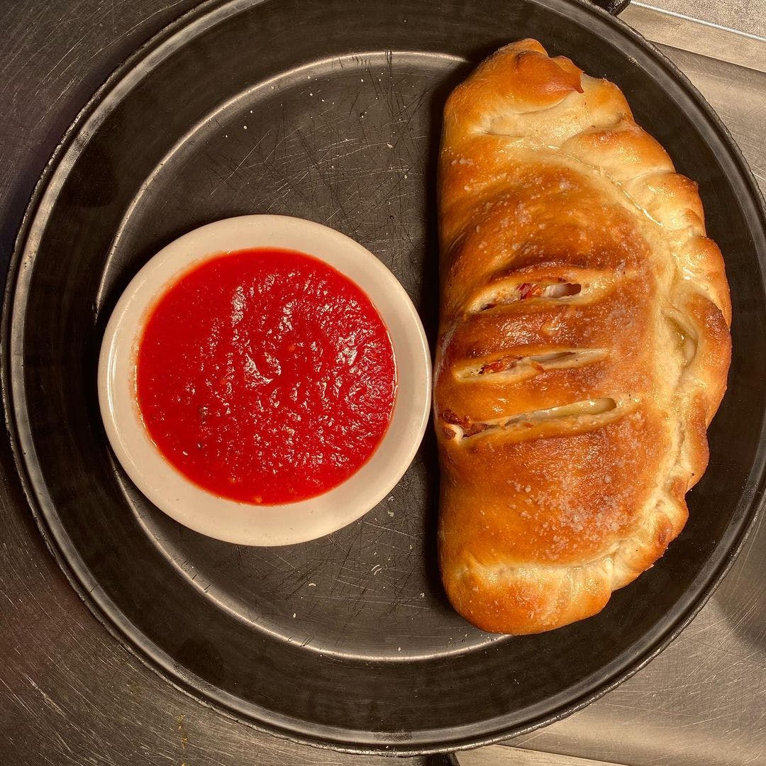 Order Meat Lover's Calzone - Small food online from Little It Deli  store, Emlenton on bringmethat.com
