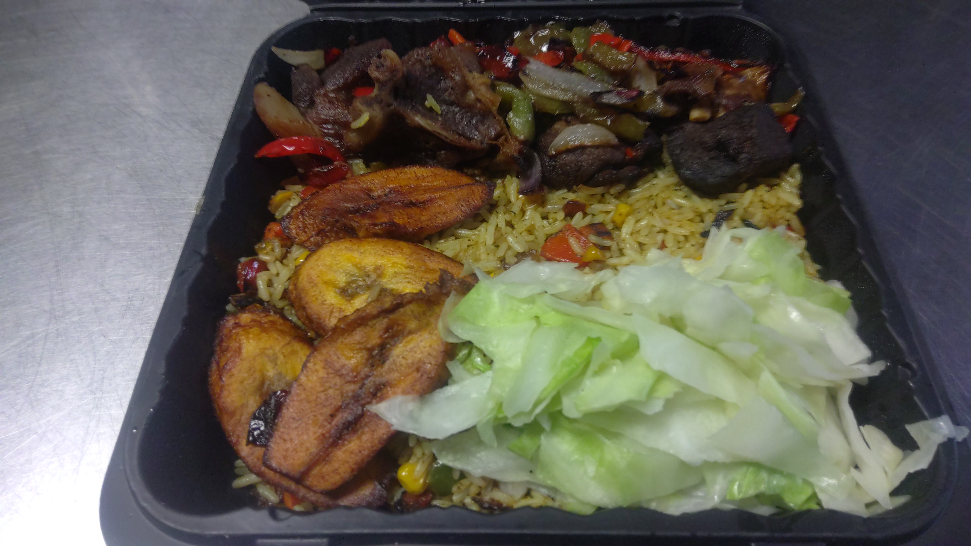 Order 2b. Rice with Asun (Charcoal Grilled Goat) food online from Africana Cuisine store, Perry Hall on bringmethat.com