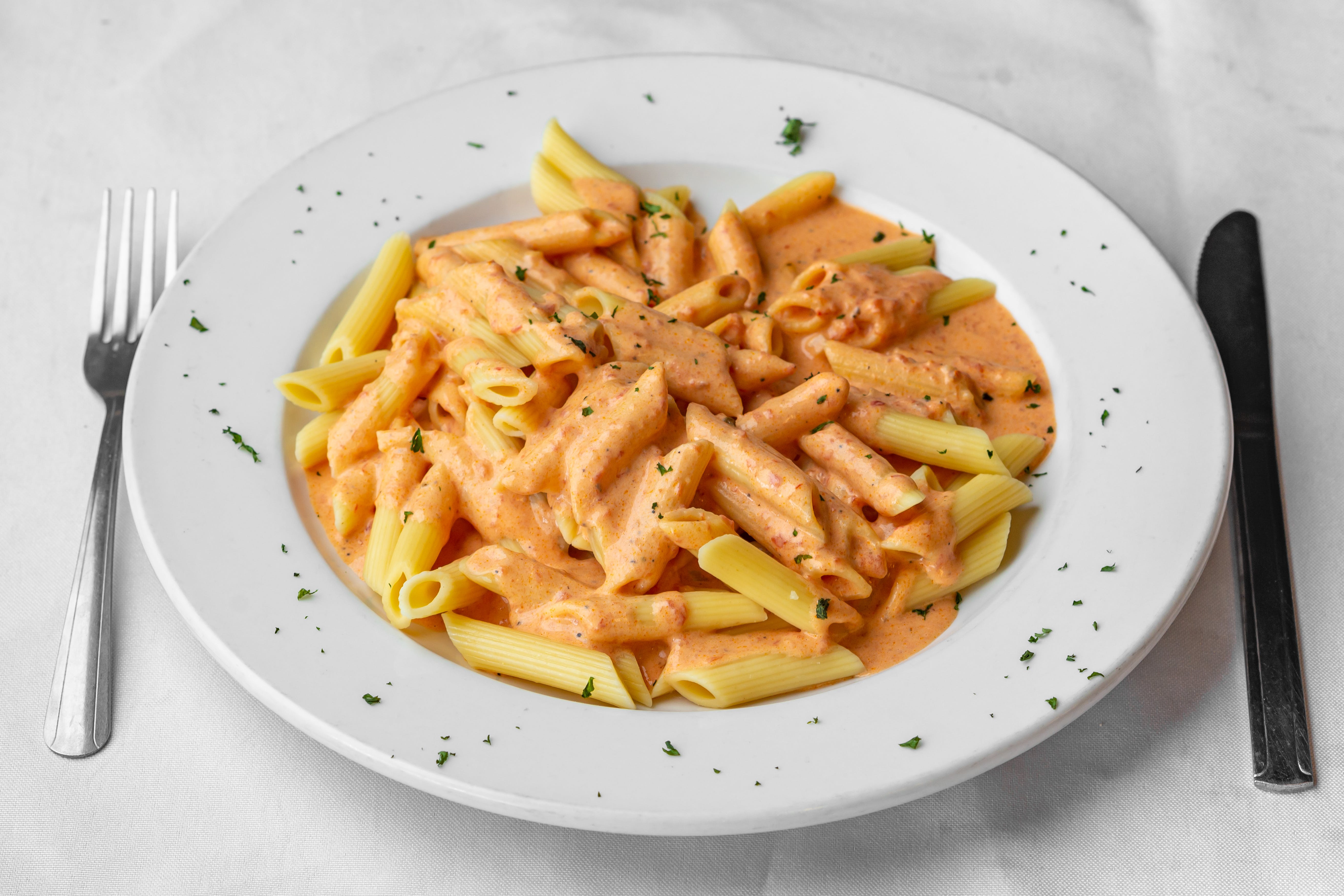 Order Penne Vodka - Pasta food online from Mangia Bella Pizza store, Somerville on bringmethat.com