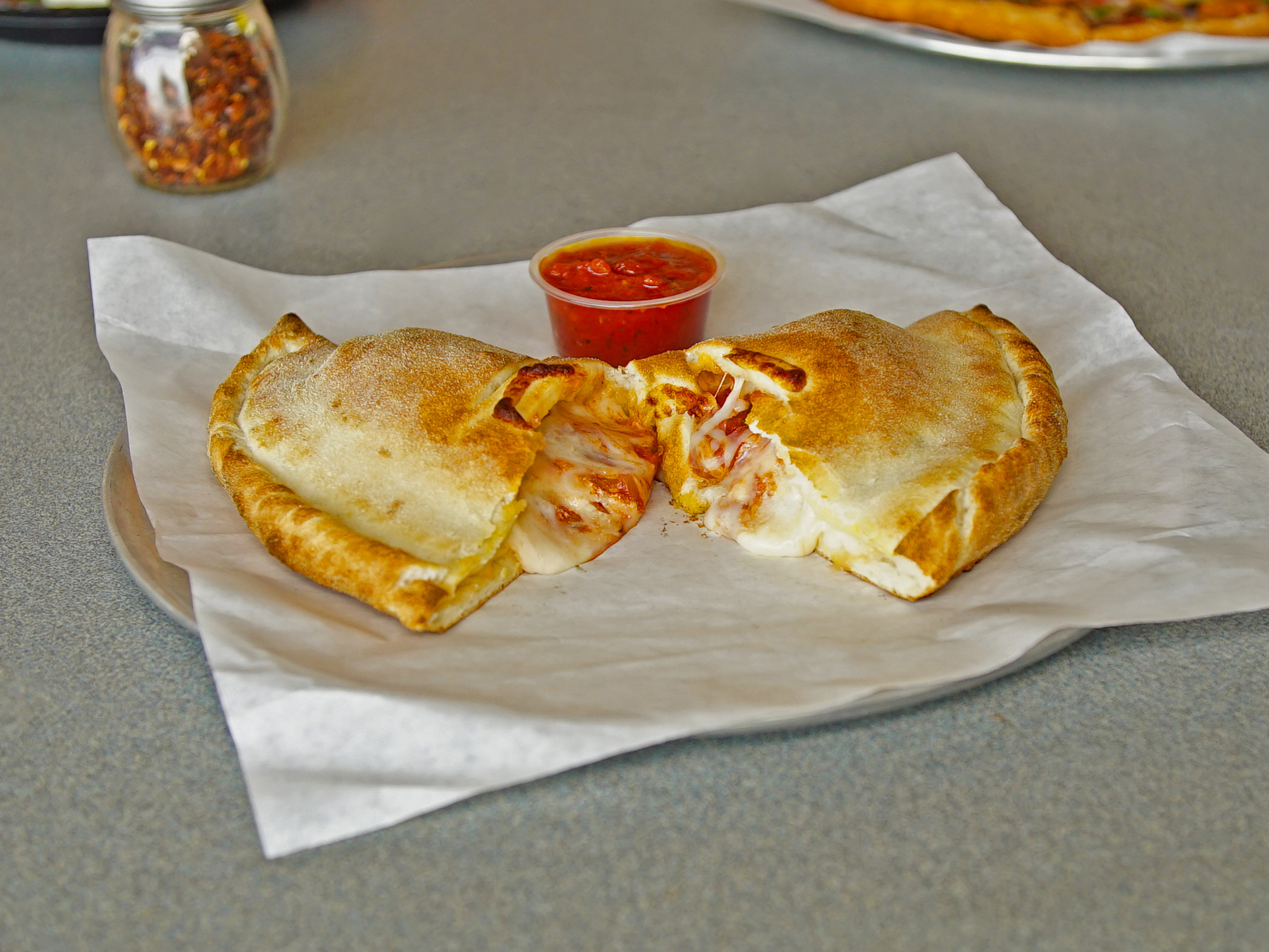 Order Create Your Own Calzone food online from Prego Pizzeria store, Encino on bringmethat.com
