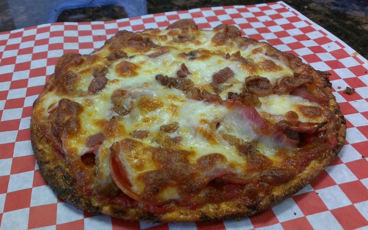Order Meat Lovers Pizza food online from Eastside Pizzeria store, Saint Paul on bringmethat.com