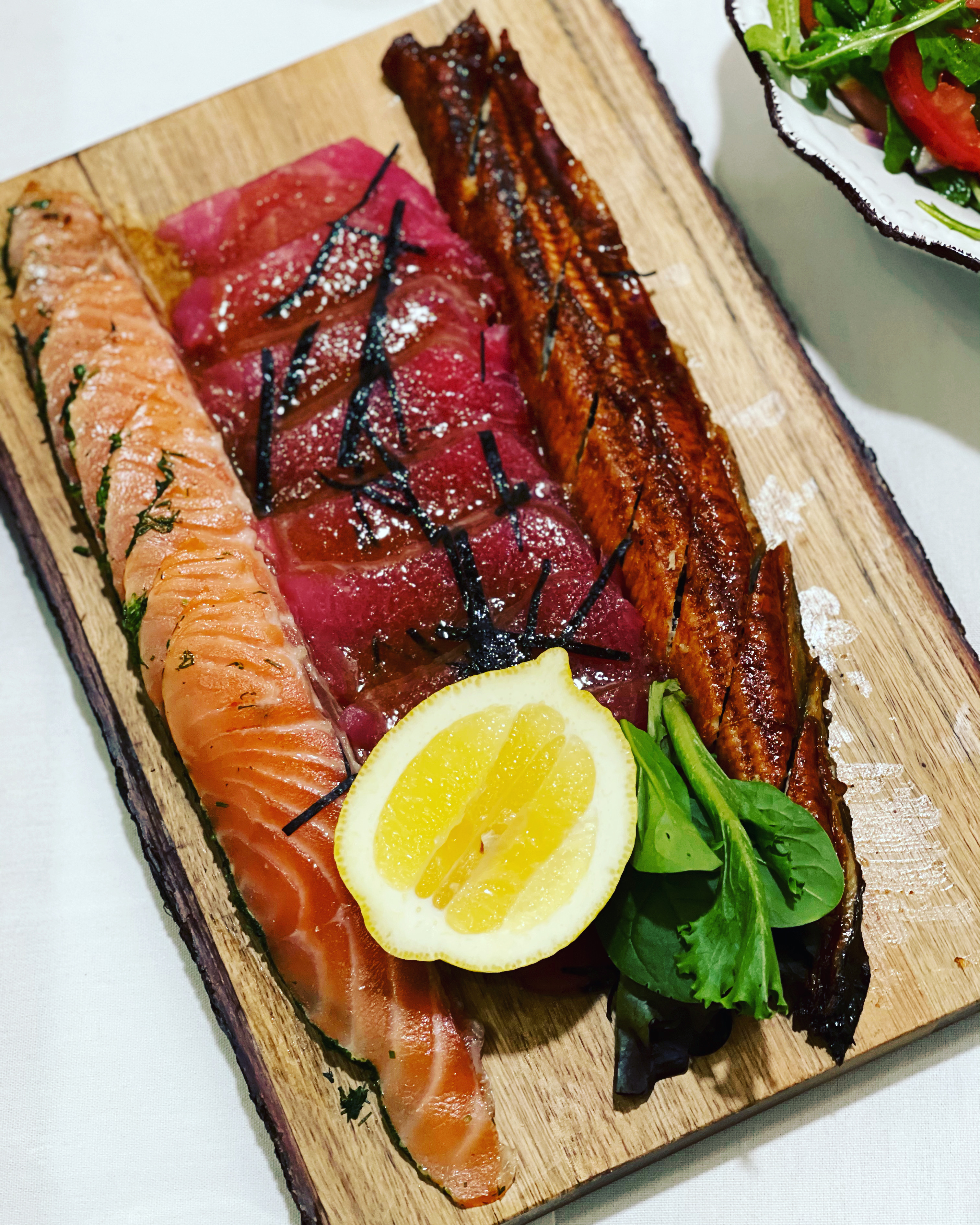 Order Fish Plate with Salmon Gravlax, Sashimi Tuna, and Eel food online from Lali Restaurant store, Philadelphia on bringmethat.com