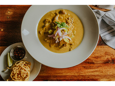 Order Khao Soi food online from Yes Siam Thai Cafe And Bar store, Seattle on bringmethat.com