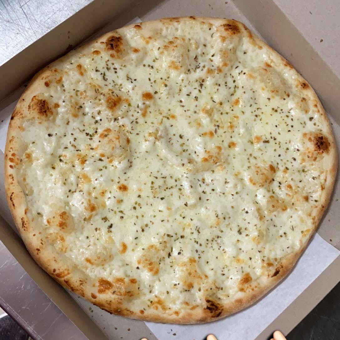 Order White Garlic Pizza - Medium 14'' (6 Slices) food online from Pujols Pizzeria store, Bethlehem on bringmethat.com