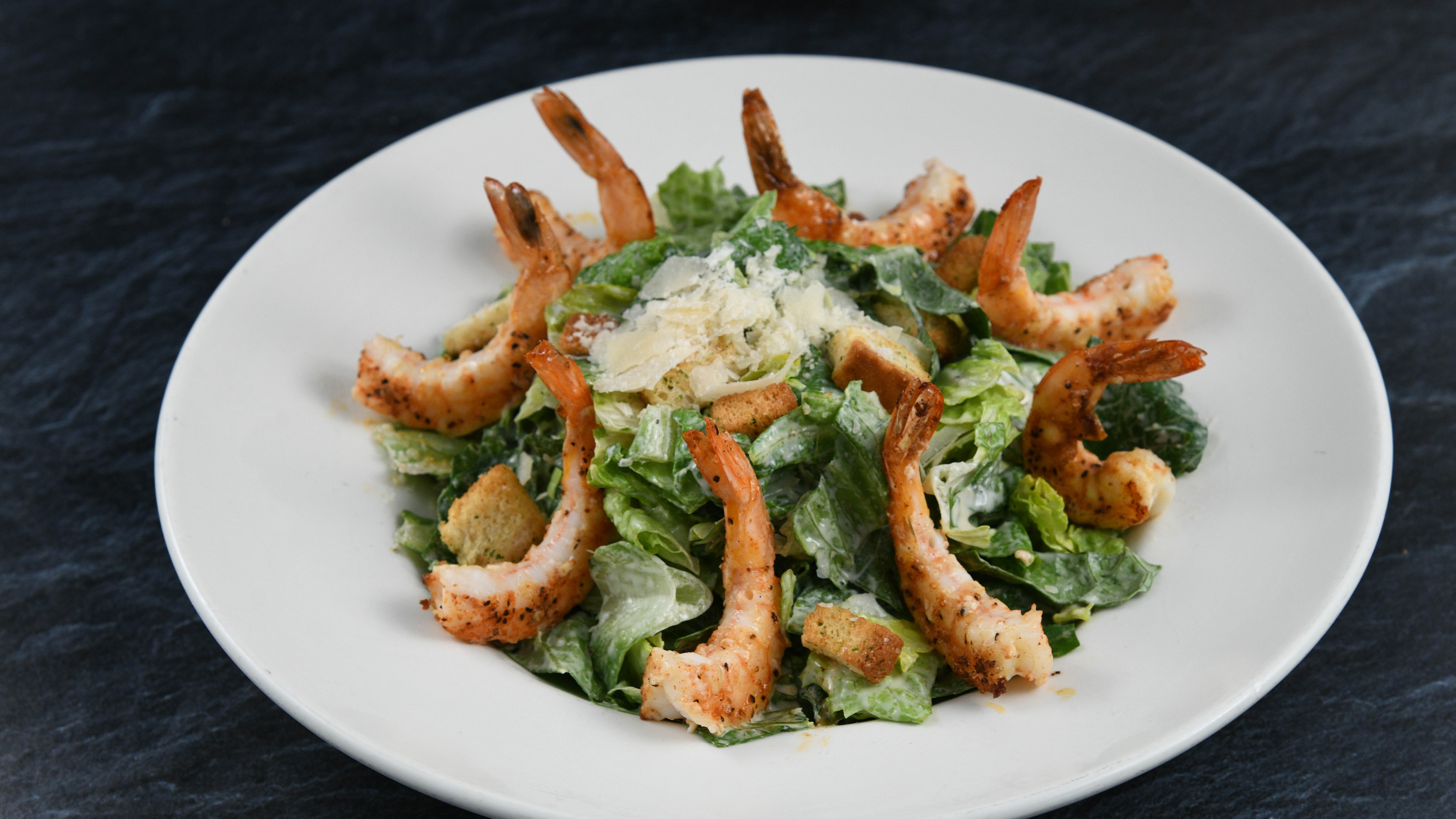 Order Big Islander Caesar Salad with Shrimp food online from Rainforest Cafe store, Atlantic City on bringmethat.com
