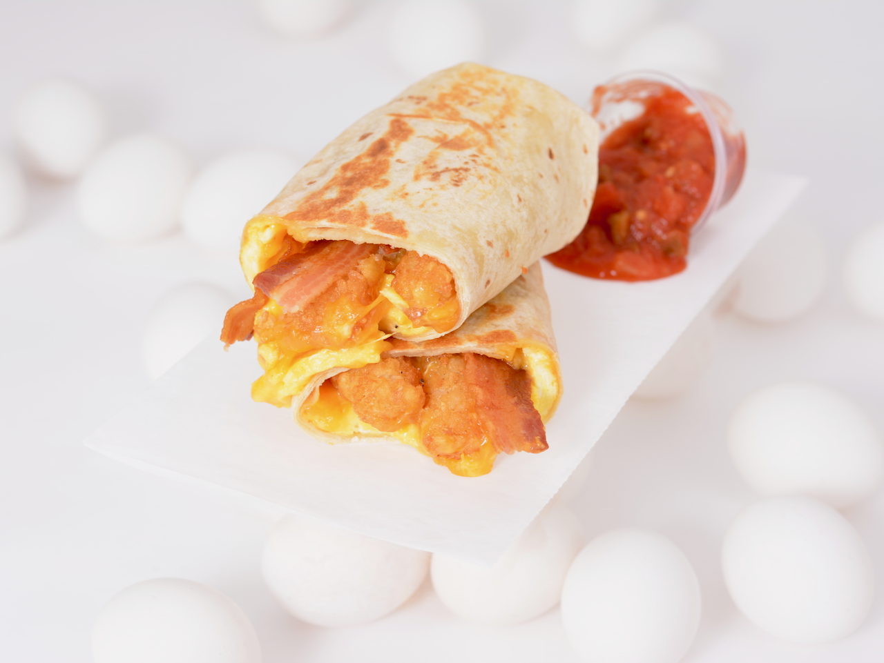 Order Bacon, Egg and Cheddar Burrito  food online from Breakfast Town store, Troy on bringmethat.com